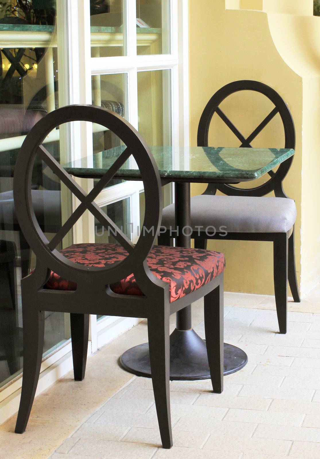 Modern table and chair setting in outdoor restaurant