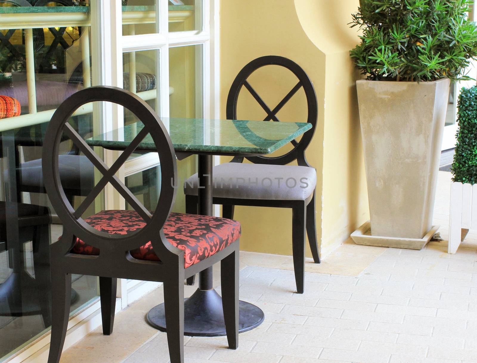 Modern table and chair setting in outdoor restaurant