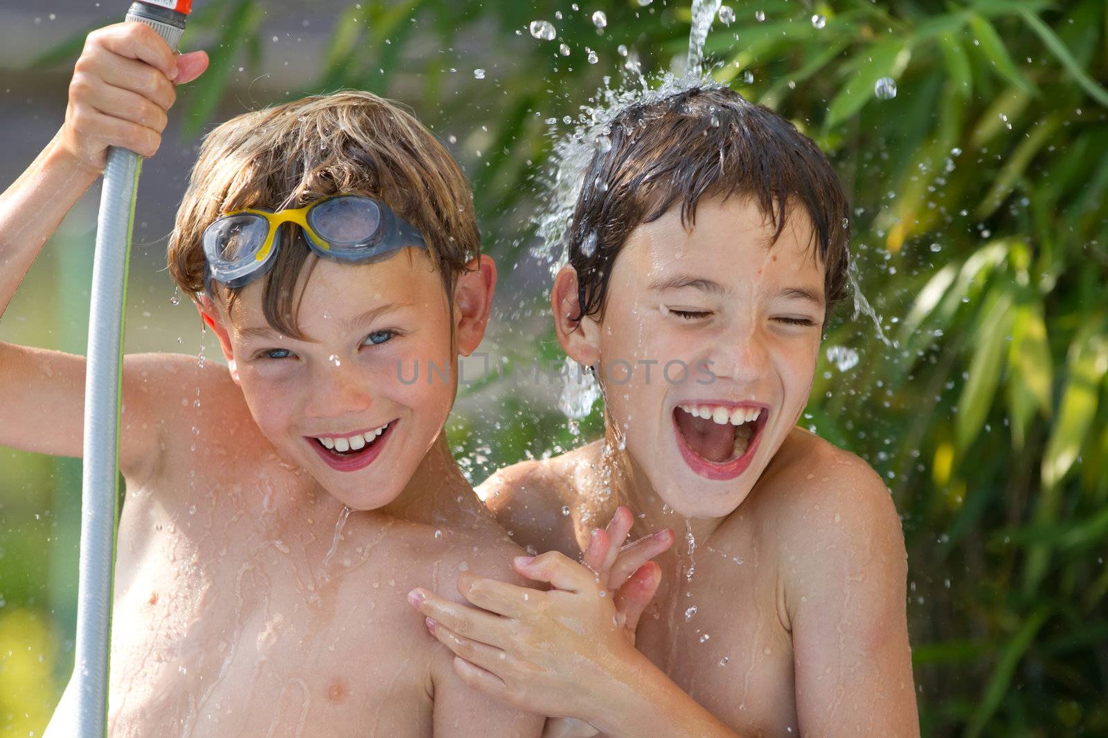 Young children playing in the water