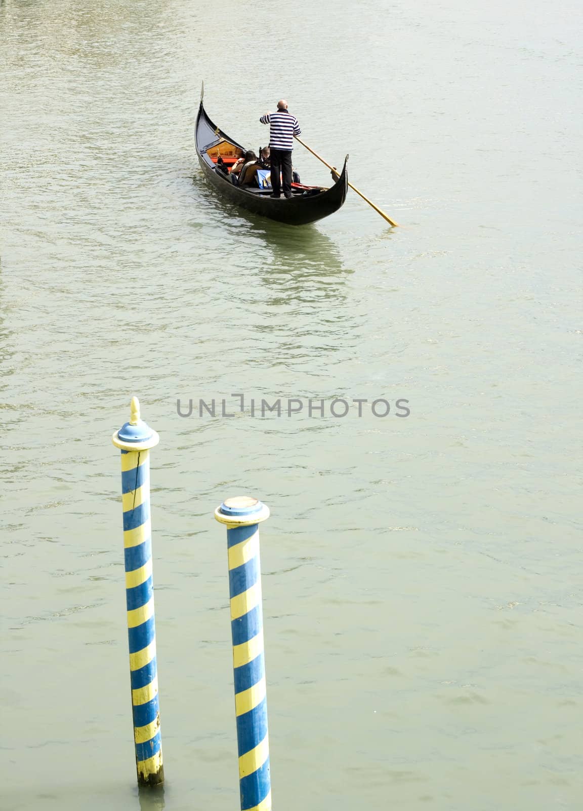 Gondolier in the Venice lagoon , Italy