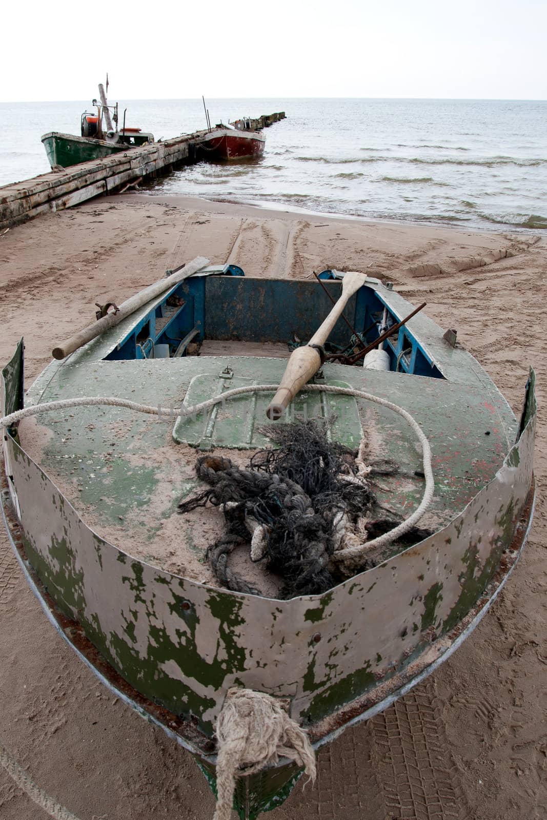 an old fishing boat at the beach