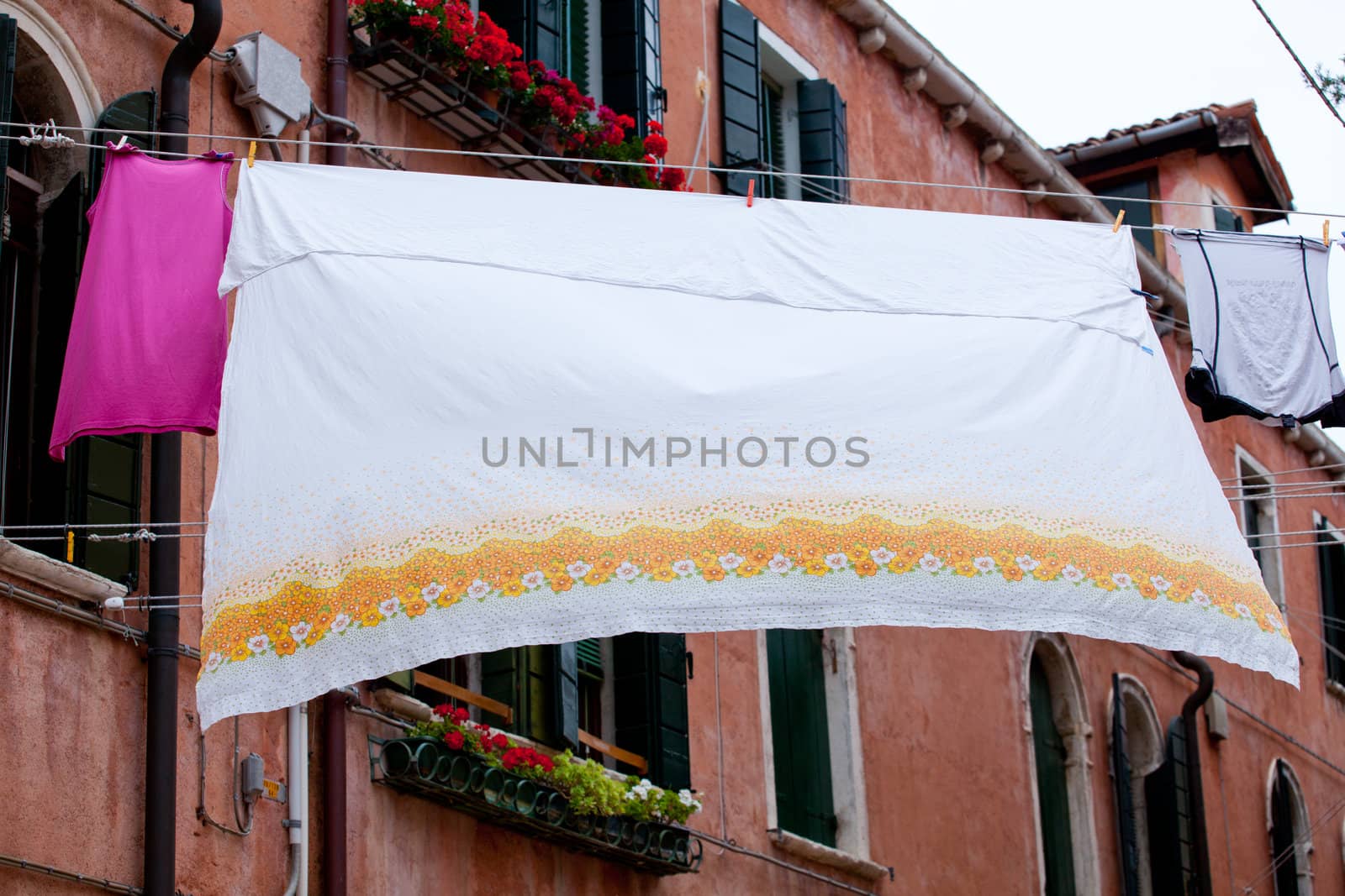 White laundry hanging to dry on a clothes-line.