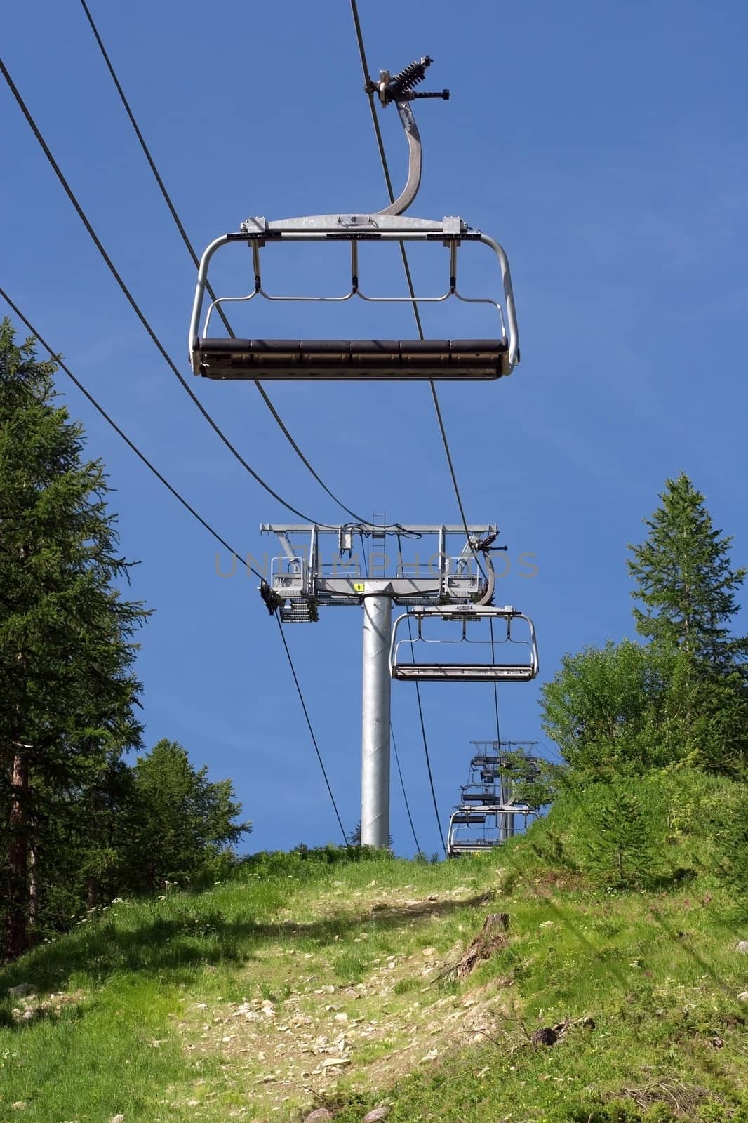 empty ski lift during the summer by chrisroll