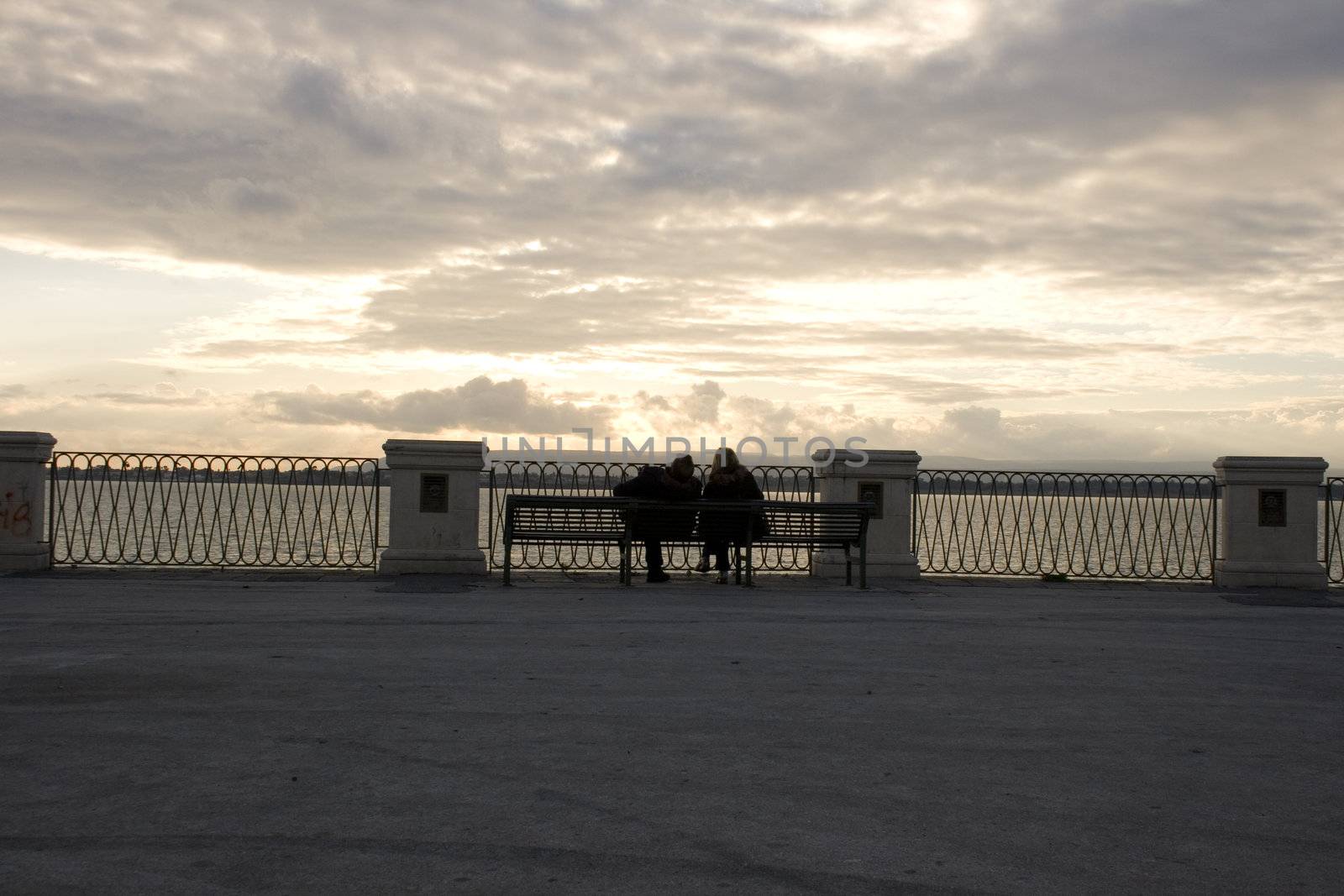 Couples sittting on the bench, Ortigia