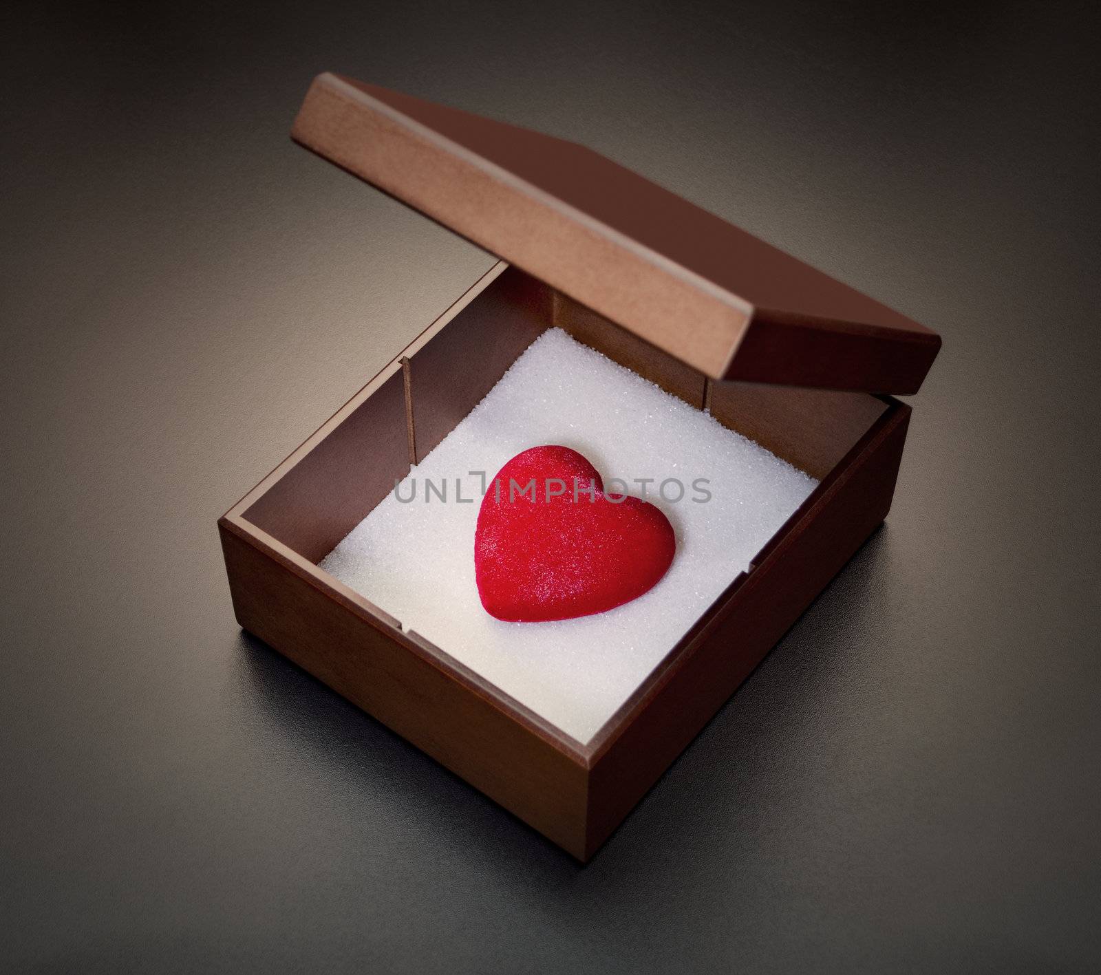 Red heart in a wooden box