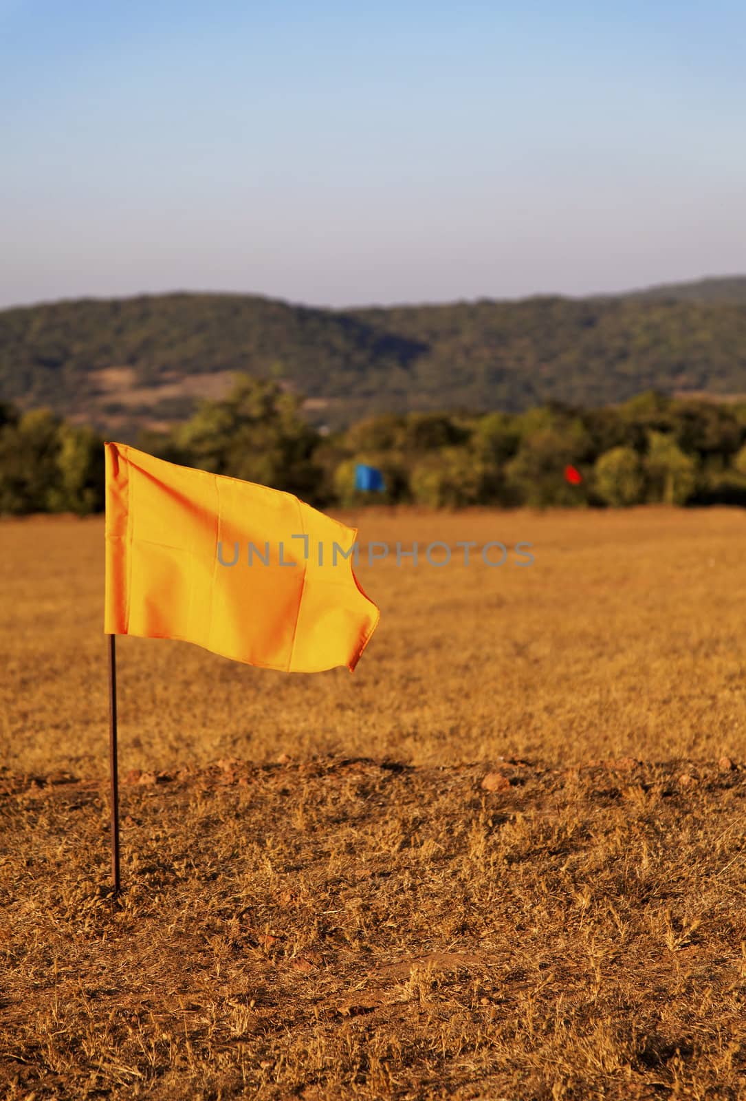 golf drive range in Mahabhaleshwar India, 100 metre colored flag markers, portrait, crop margin and empty negative areas