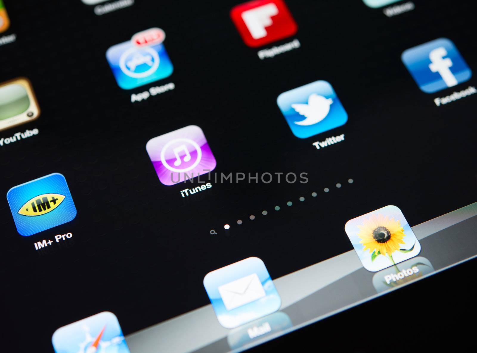 Crimea, Ukraine - October 3, 2012: A close up of an illuminated Apple iPad New screen showing the App Store and various apps