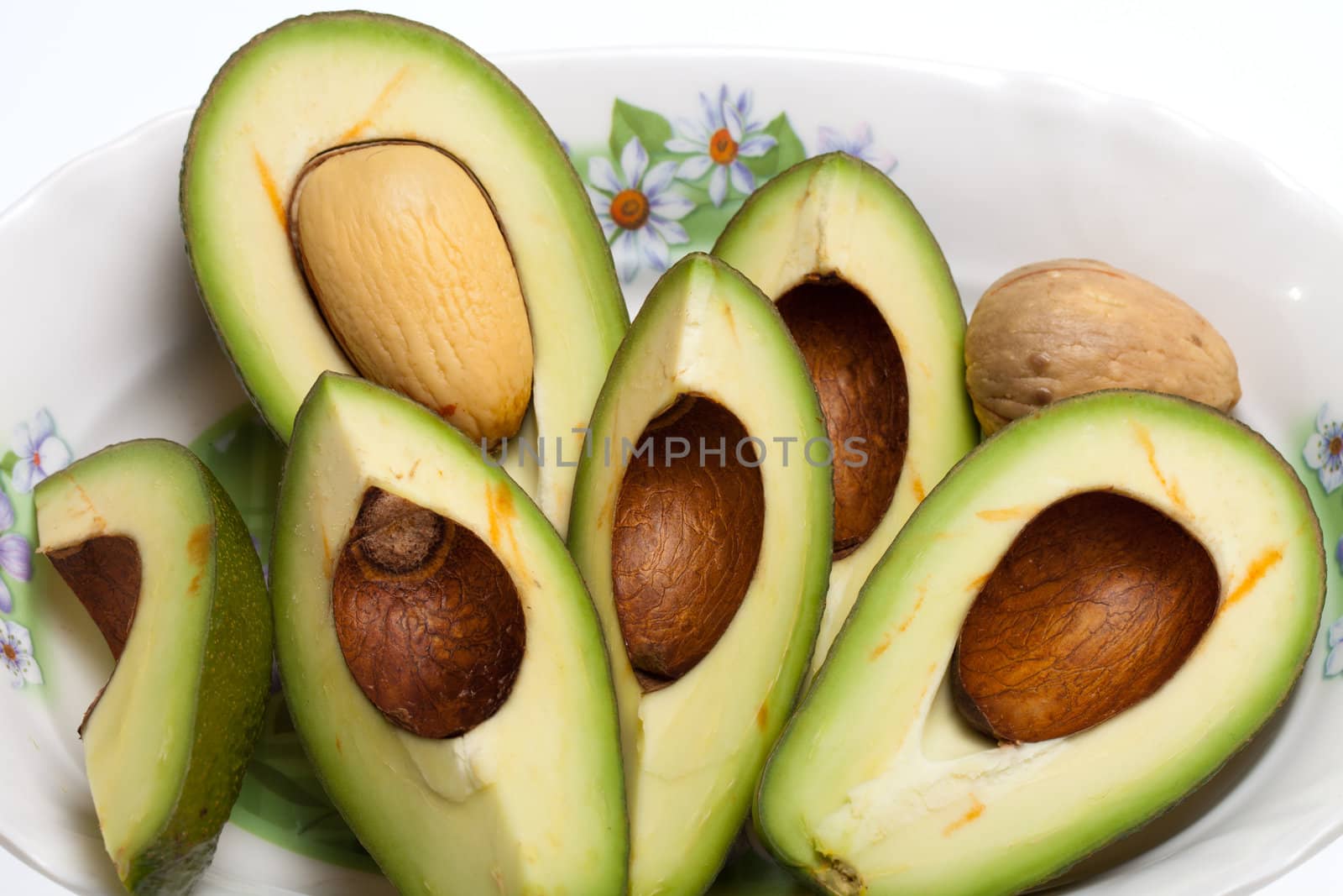 Fresh Avocado Halves On Plate
