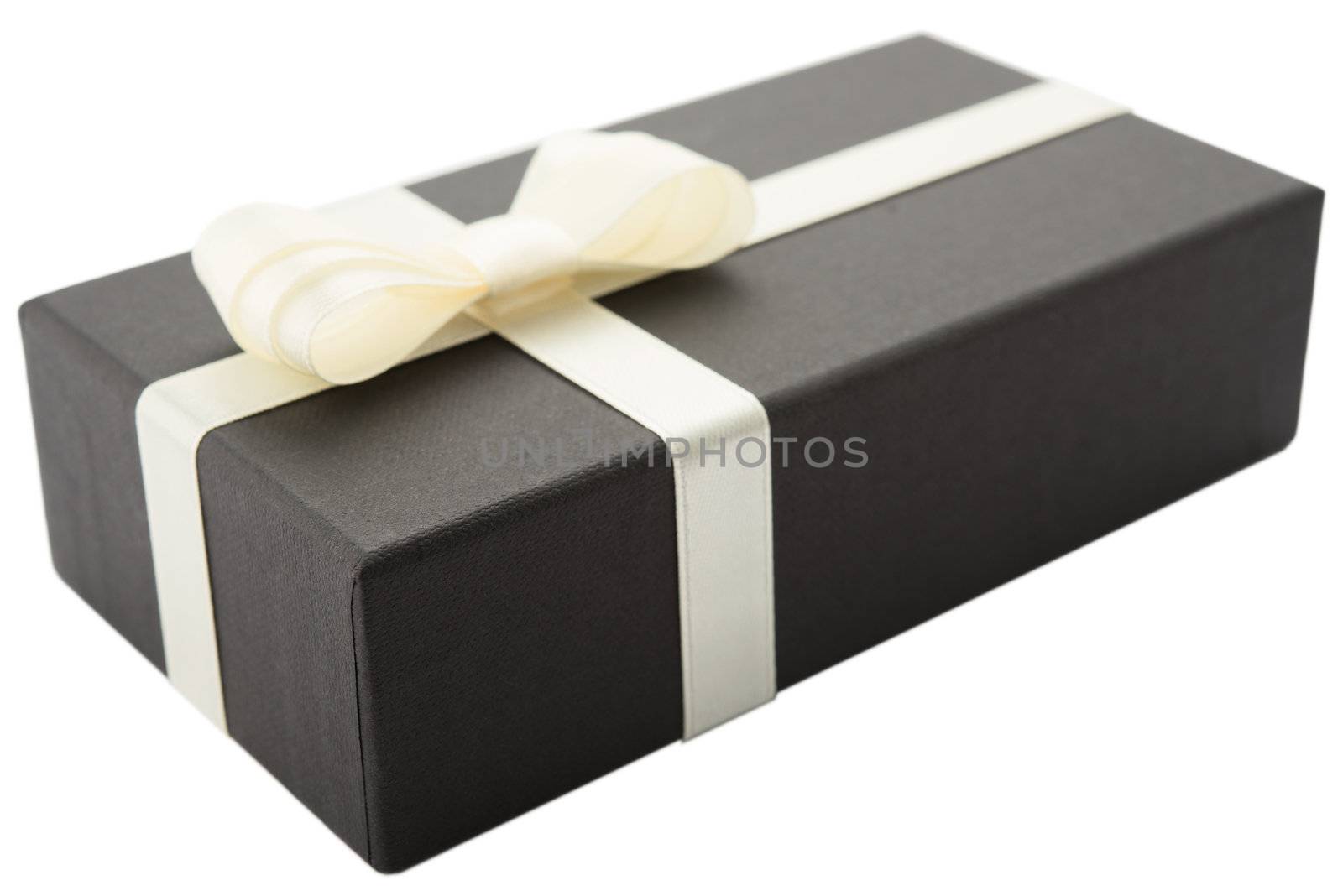 Black gift box with white bow, isolated on white background
