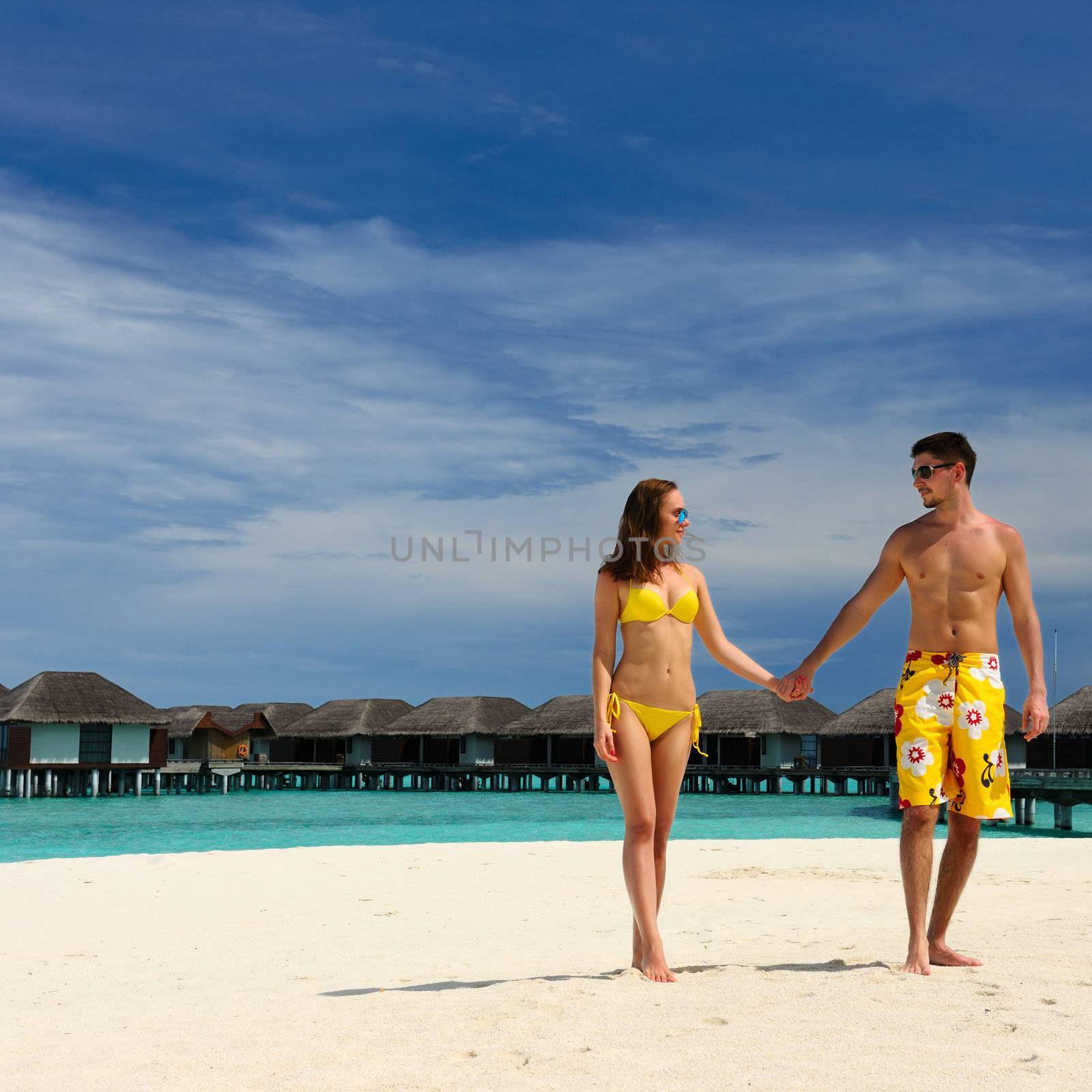 Couple on a tropical beach at Maldives