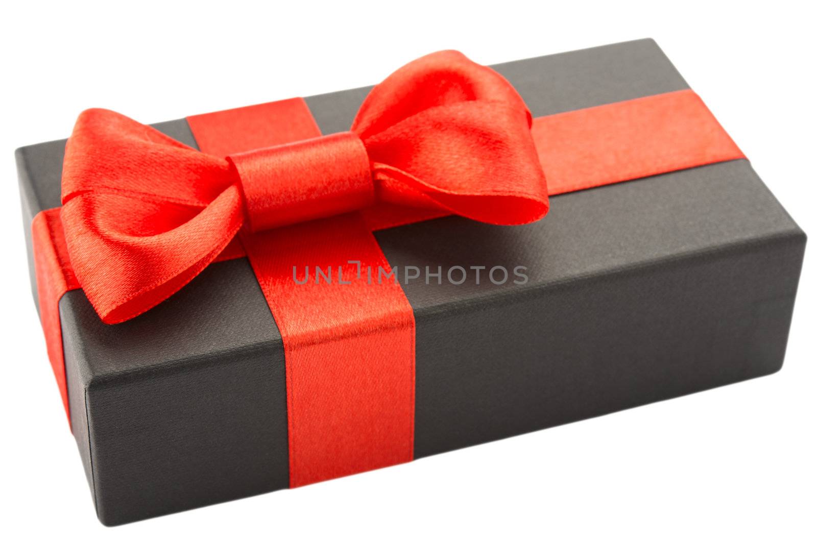 Black gift box with red bow, isolated on white background