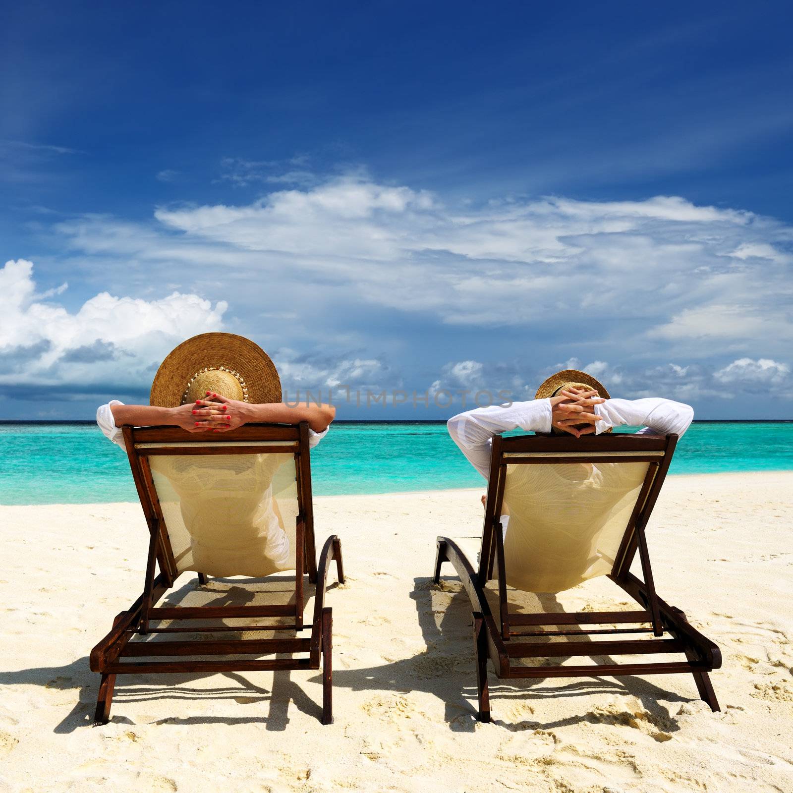 Couple on a tropical beach at Maldives