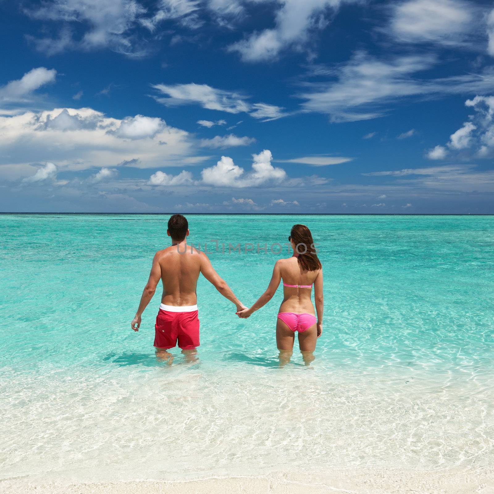Couple on a beach at Maldives by haveseen