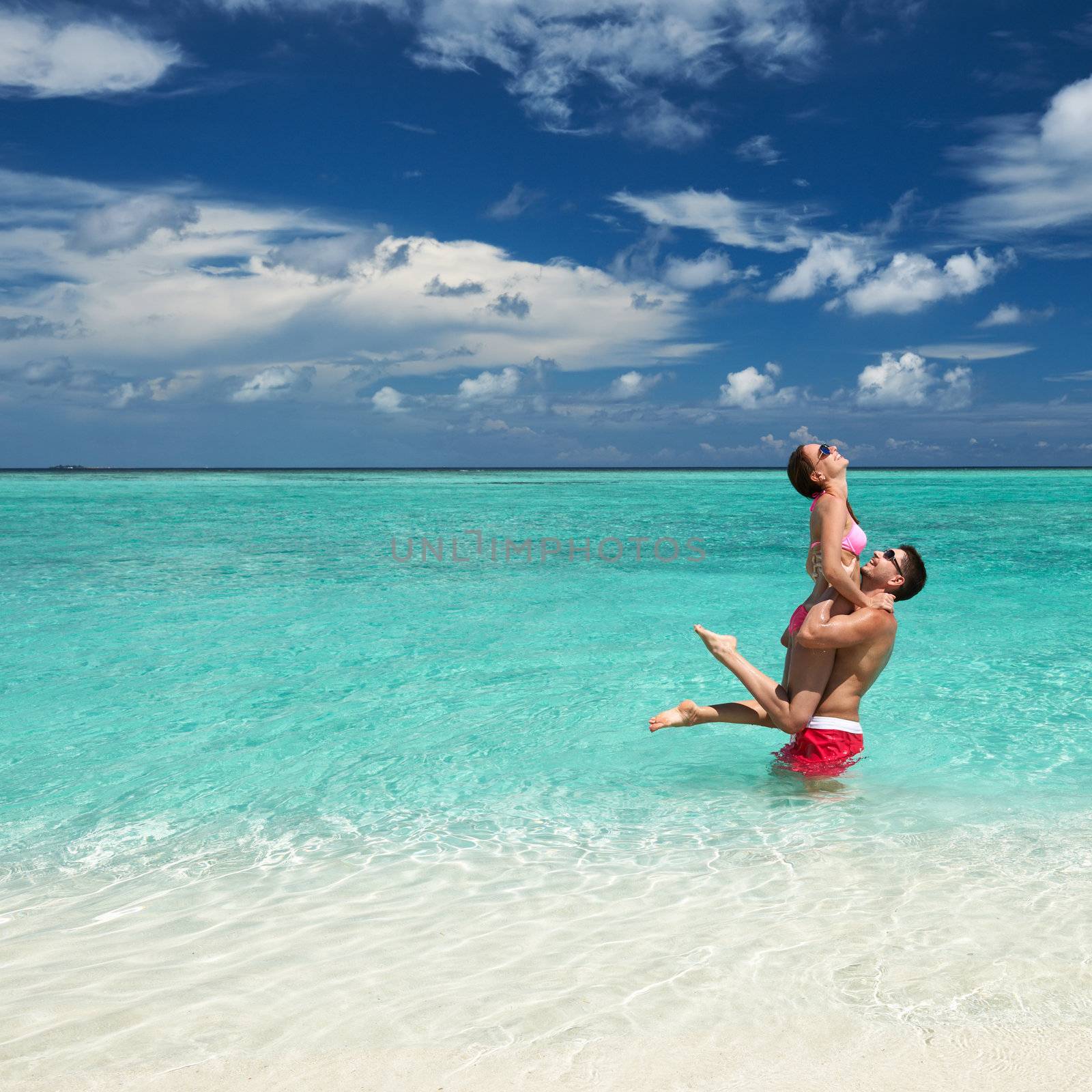 Couple on a tropical beach at Maldives