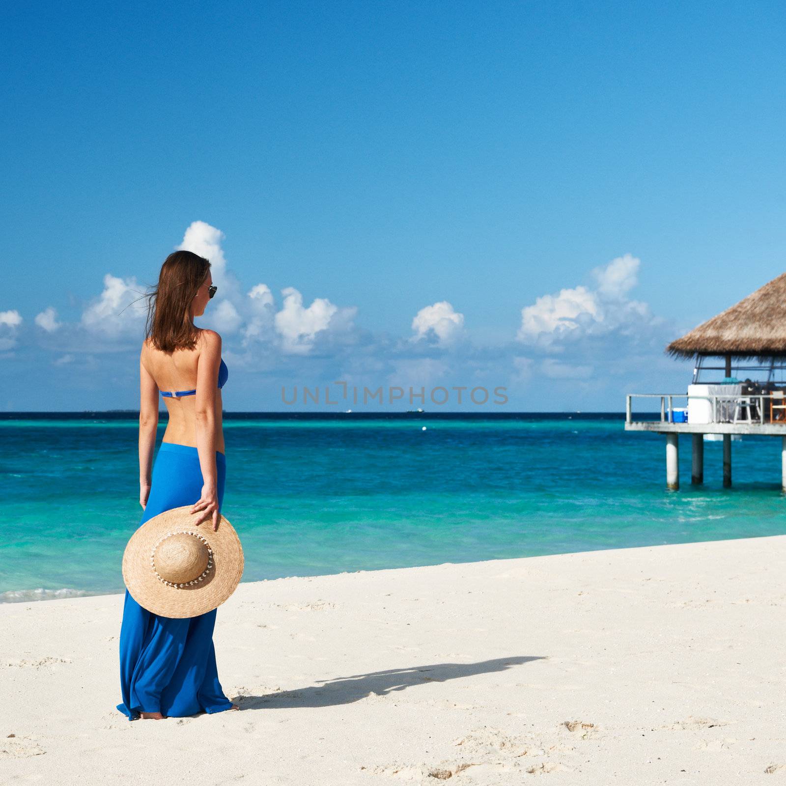 Woman in skirt at tropical beach