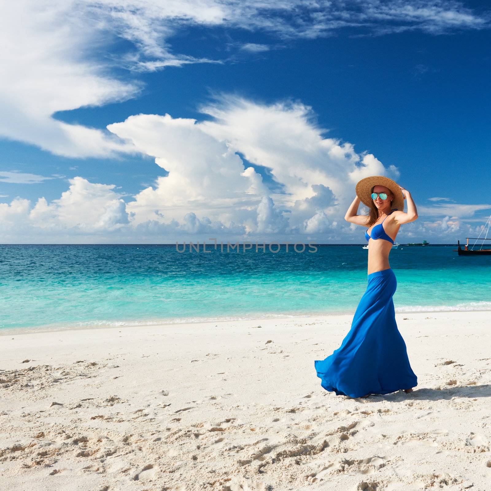 Woman in skirt at tropical beach