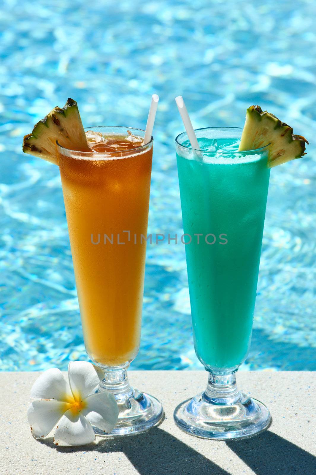 Cocktails near swimming pool by haveseen