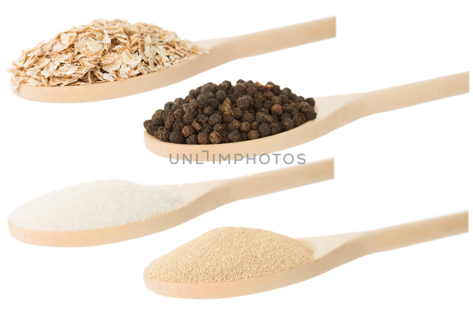 spoons with varieties groats isolated on white