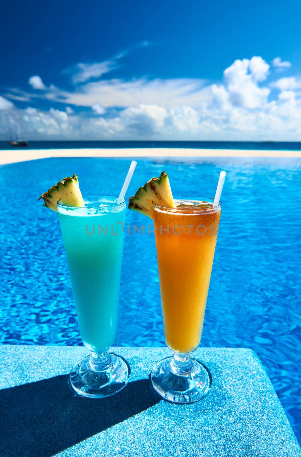Cocktails near swimming pool by haveseen