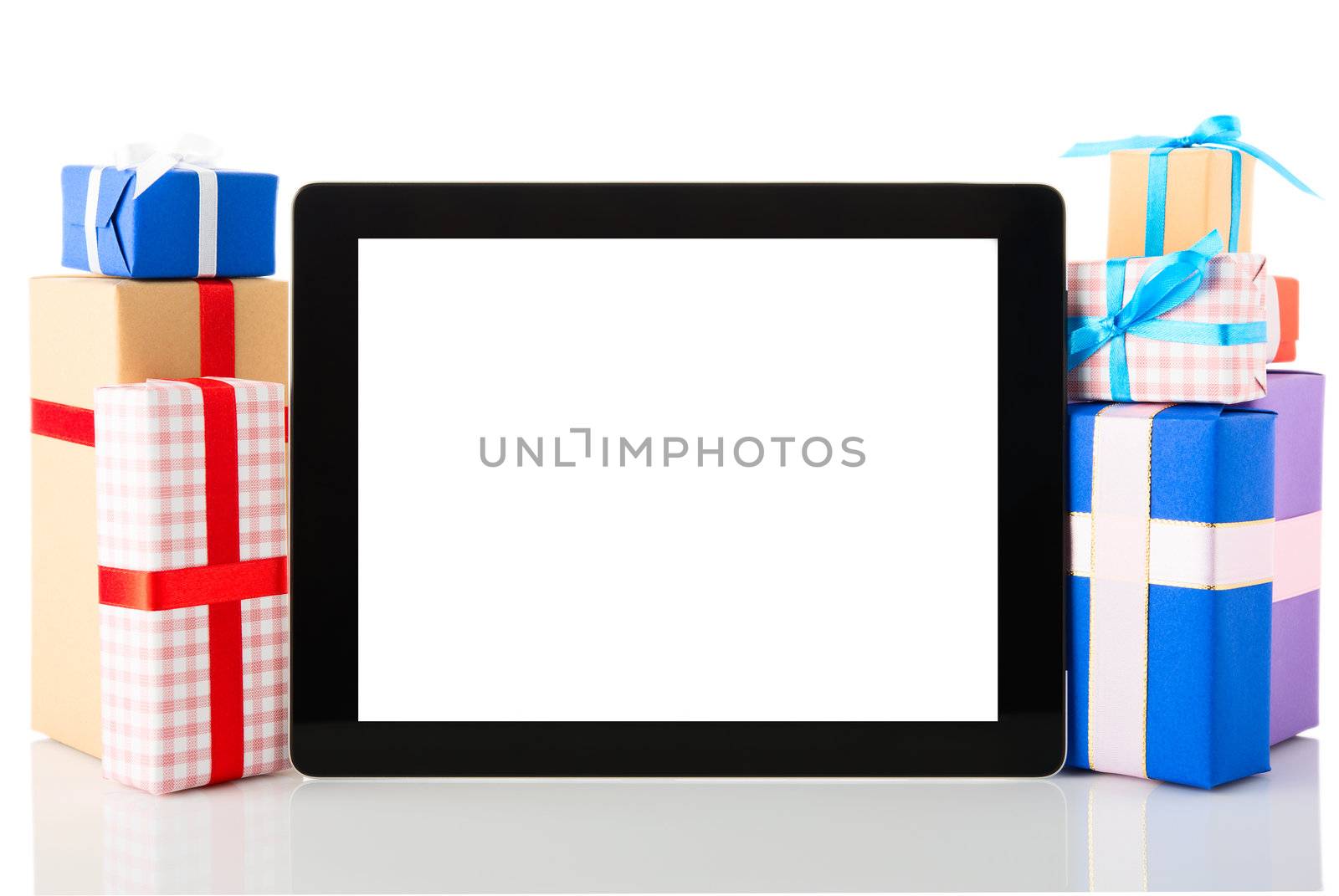 Tablet pc with gift boxes isolated on white background