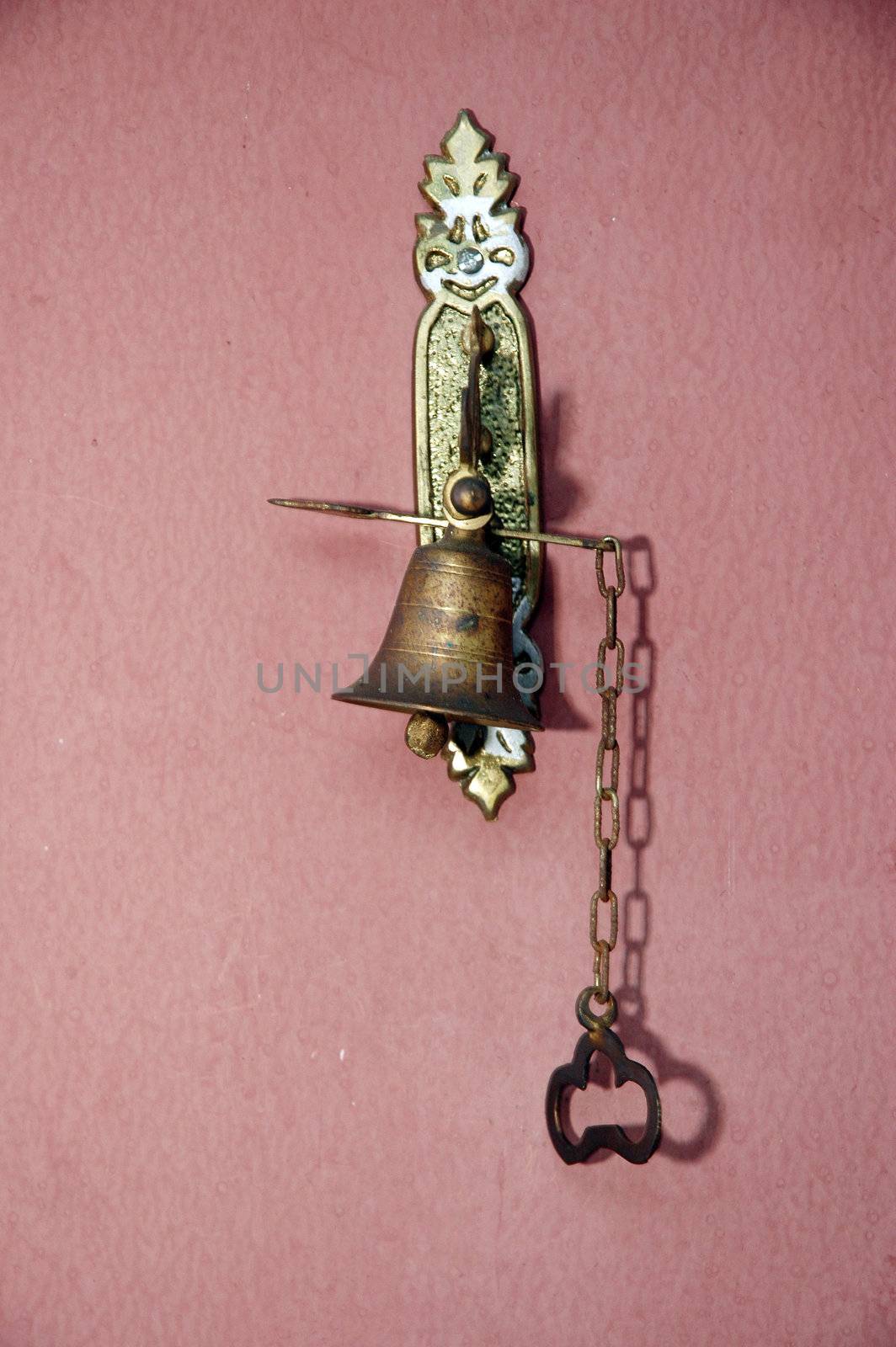 metal doorbell antique on the wall