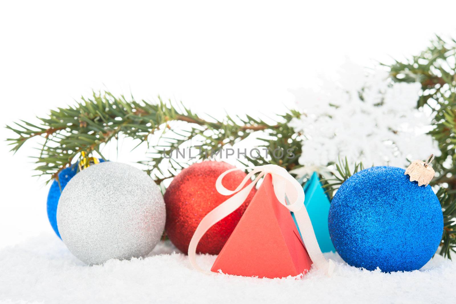 Christmas tree and decorations on a snow.