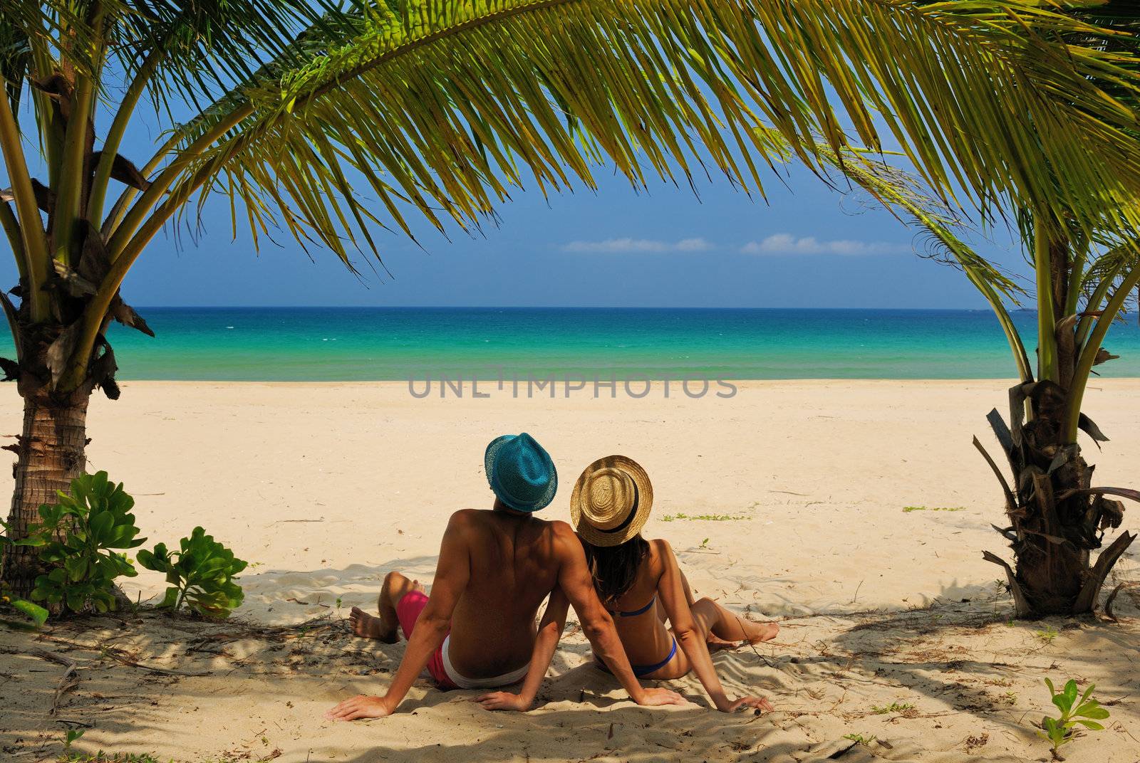 Couple on a beach by haveseen