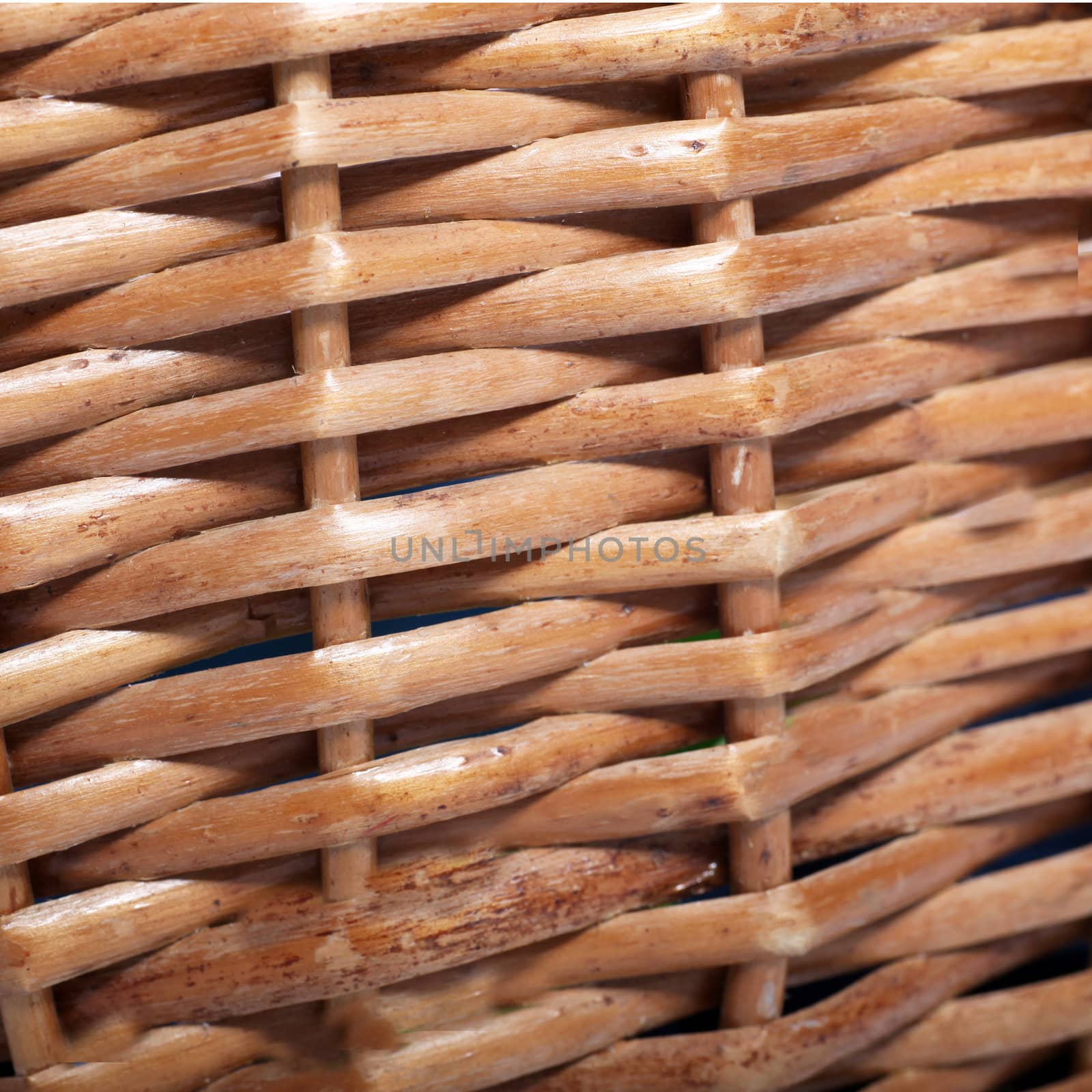 Cane or wickerwork background showing the detailed interlaced structure of the weave on a basket or item of furniture
