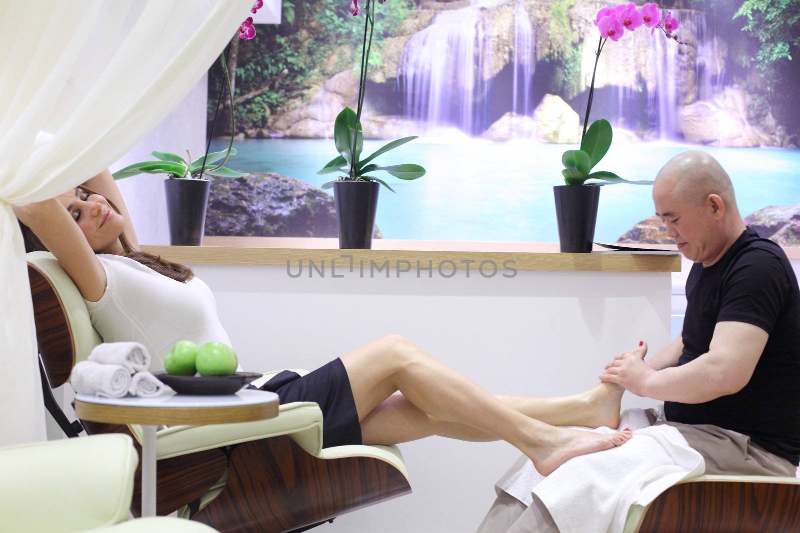 Foot massage and care in a beauty salon