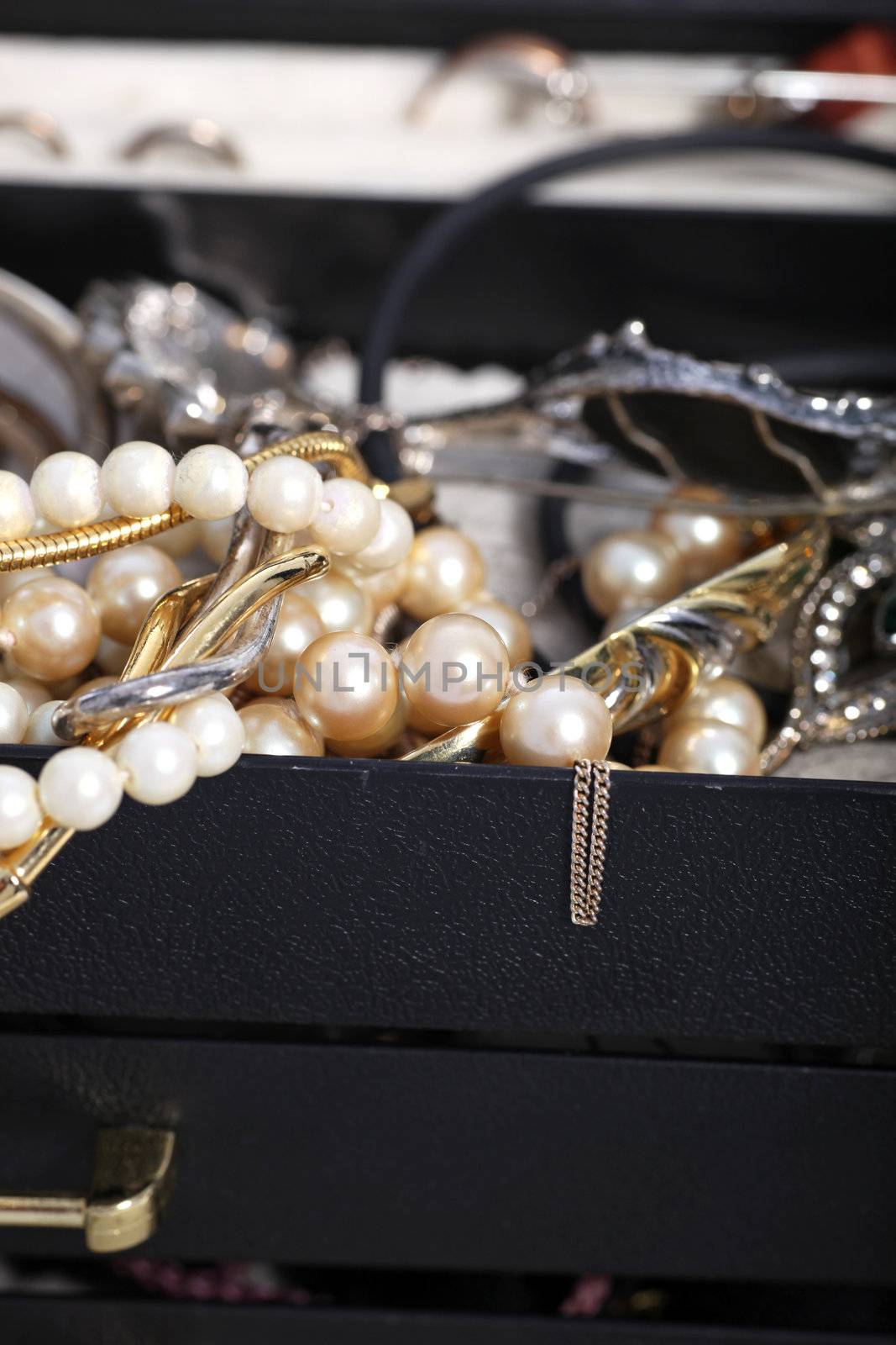 Pearls and jewellery overflowing from a box by Farina6000