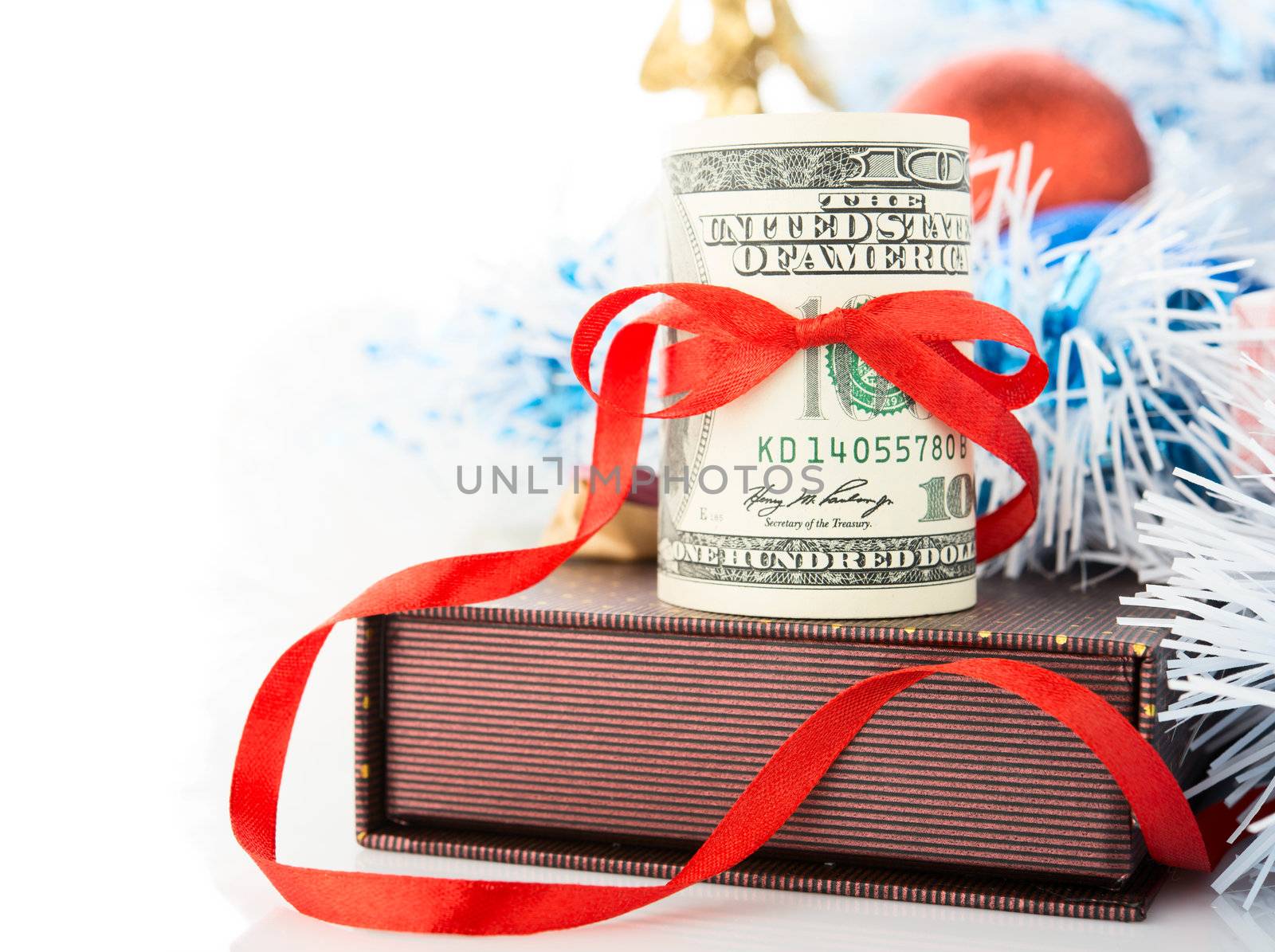 Money, gift box and Christmas decorations on white background.