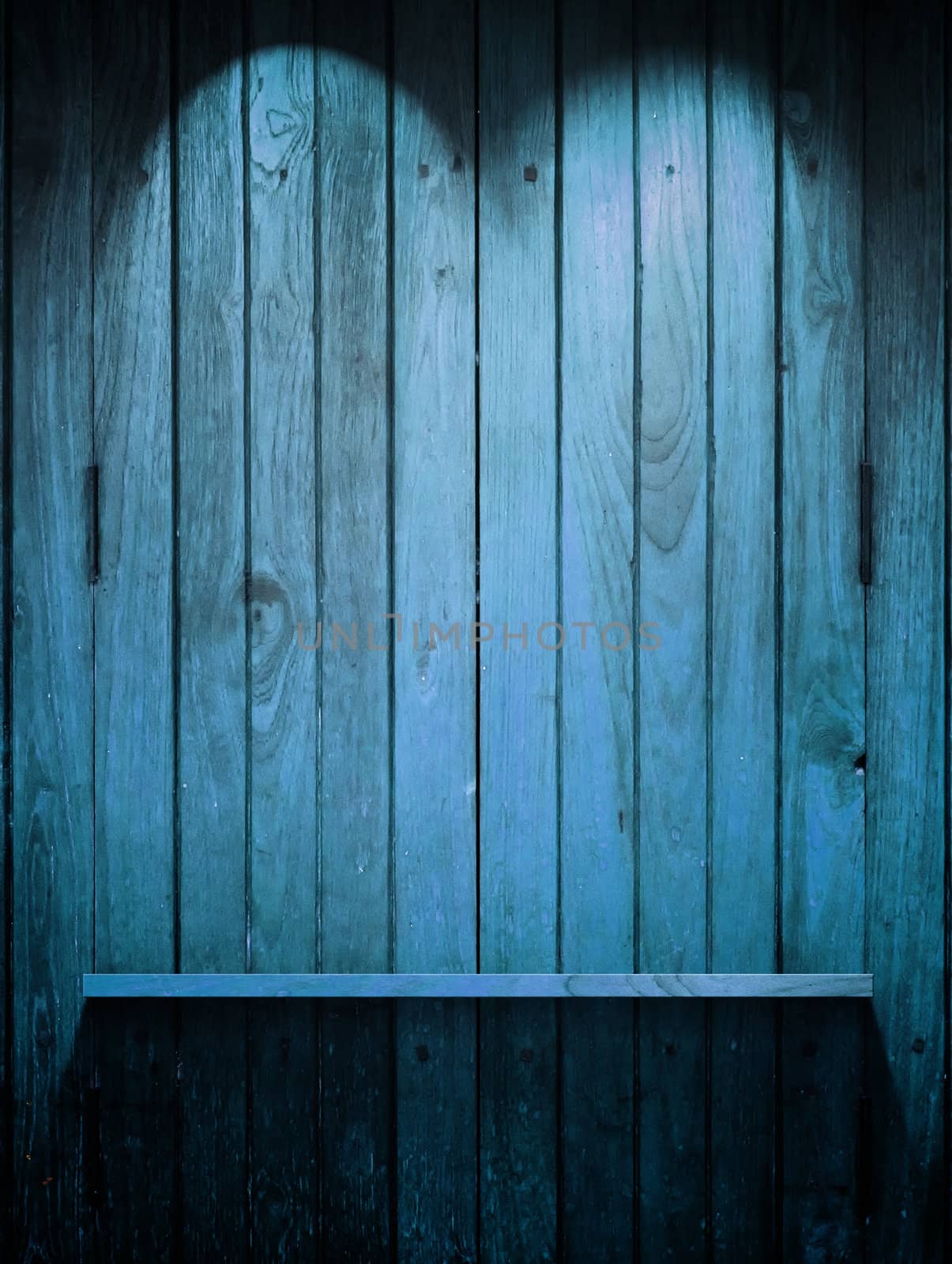 Empty Wood blue Shelf on wall with Top light and shadow