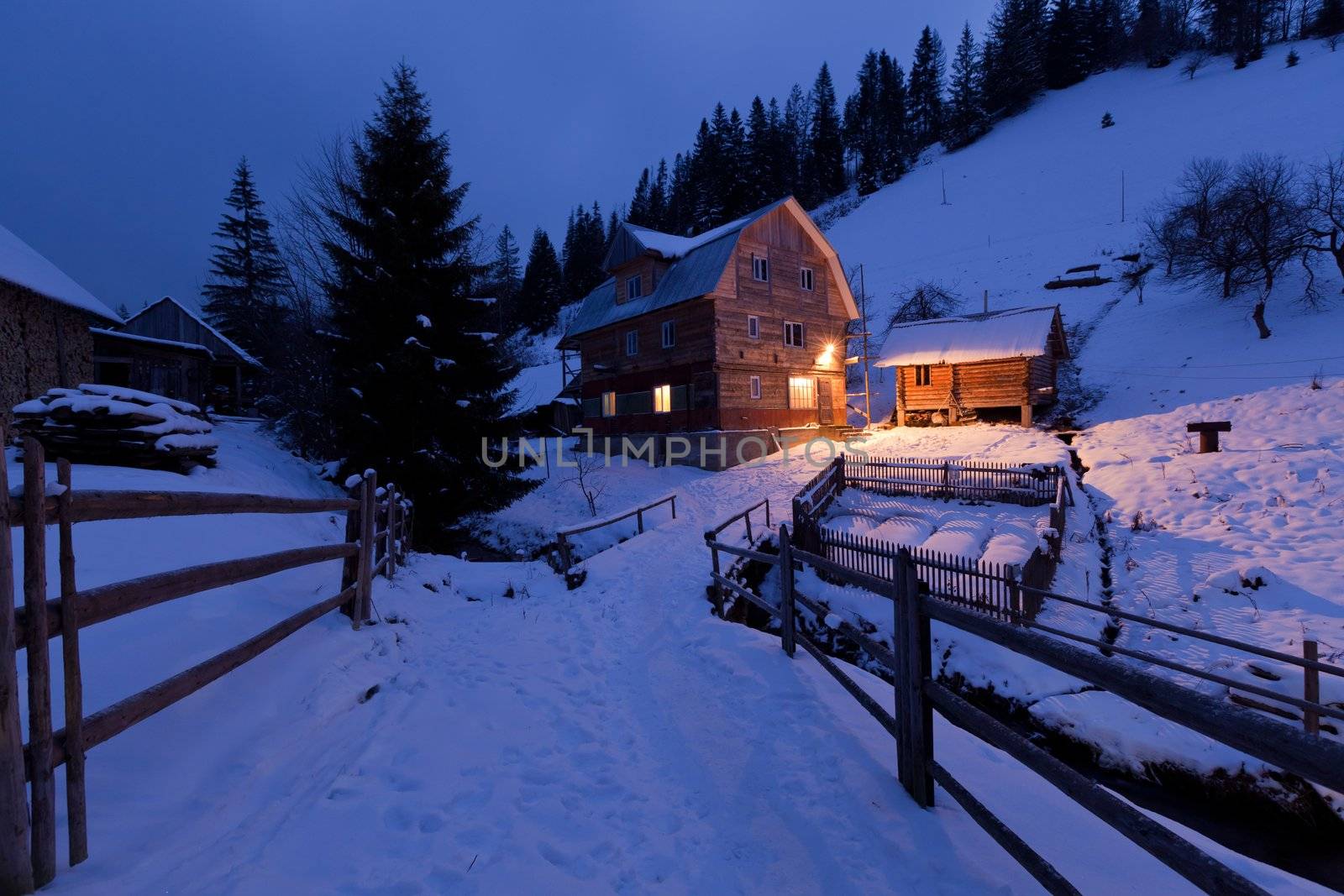 Evening in mountains. Village house in the Ukrainian Carpathians.