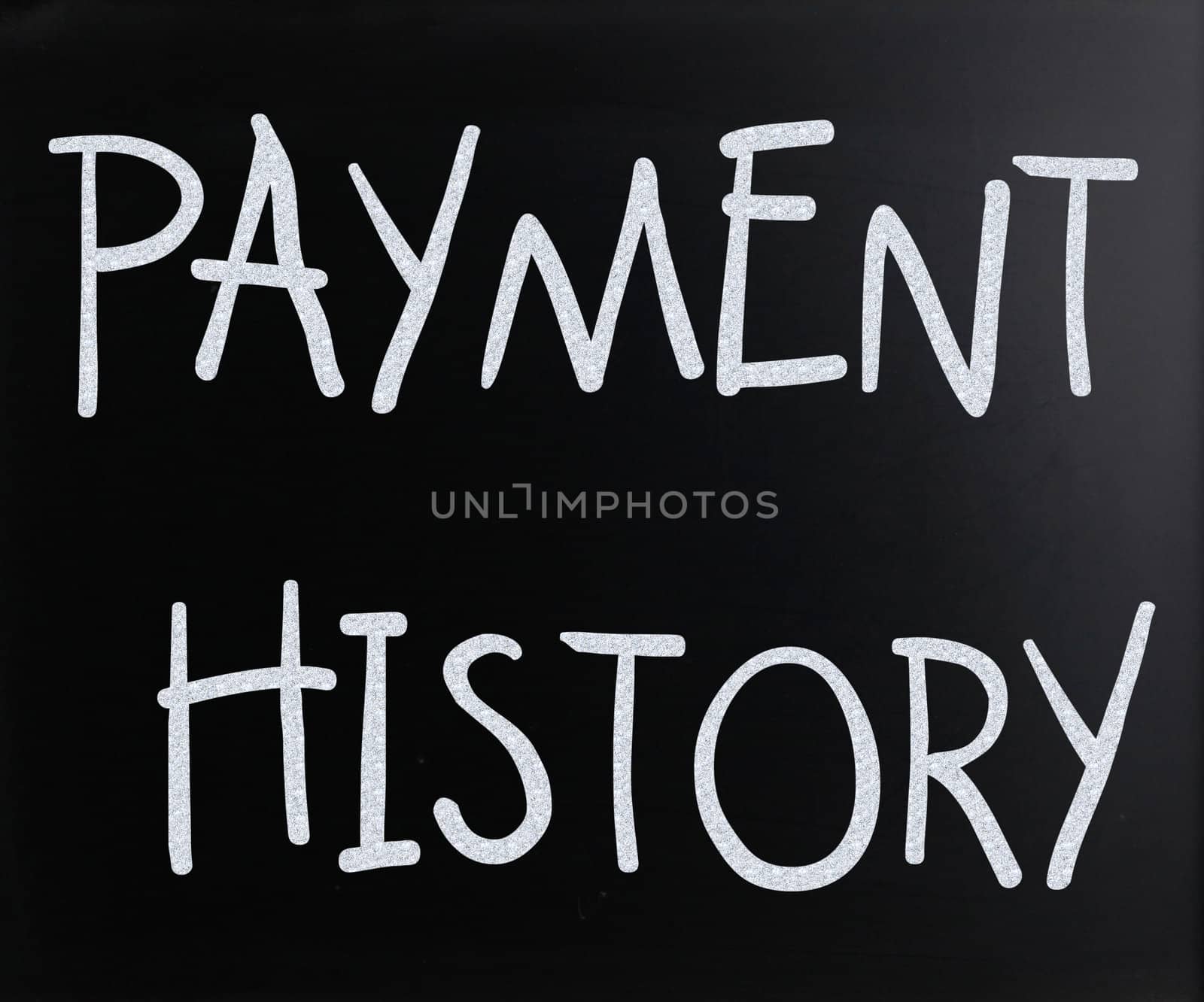 "Payment history" handwritten with white chalk on a blackboard