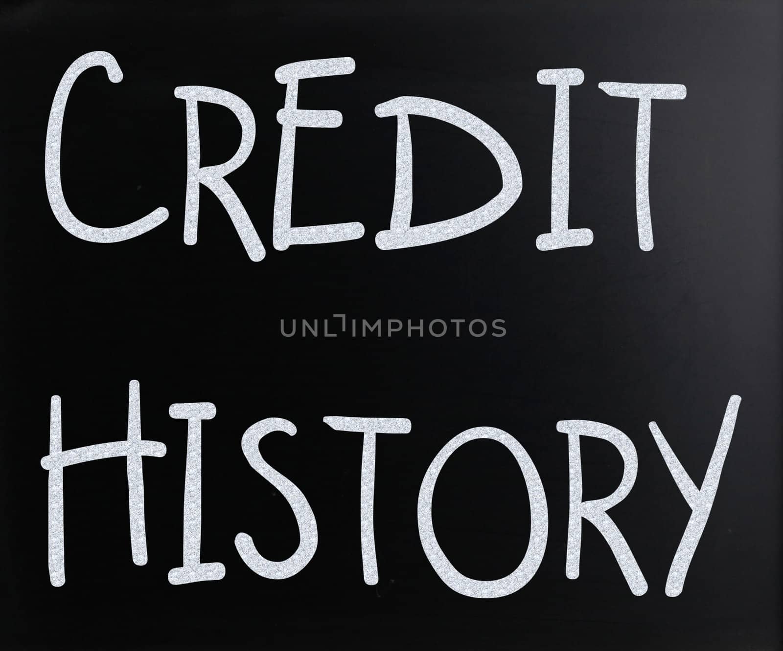 "Credit history" handwritten with white chalk on a blackboard