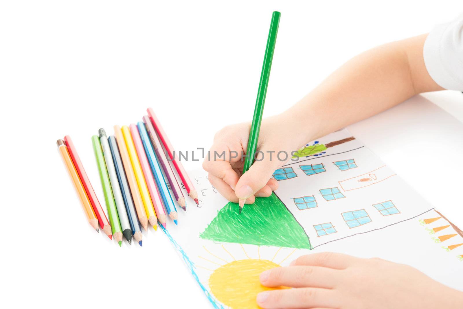 Child drawing a home with pencil