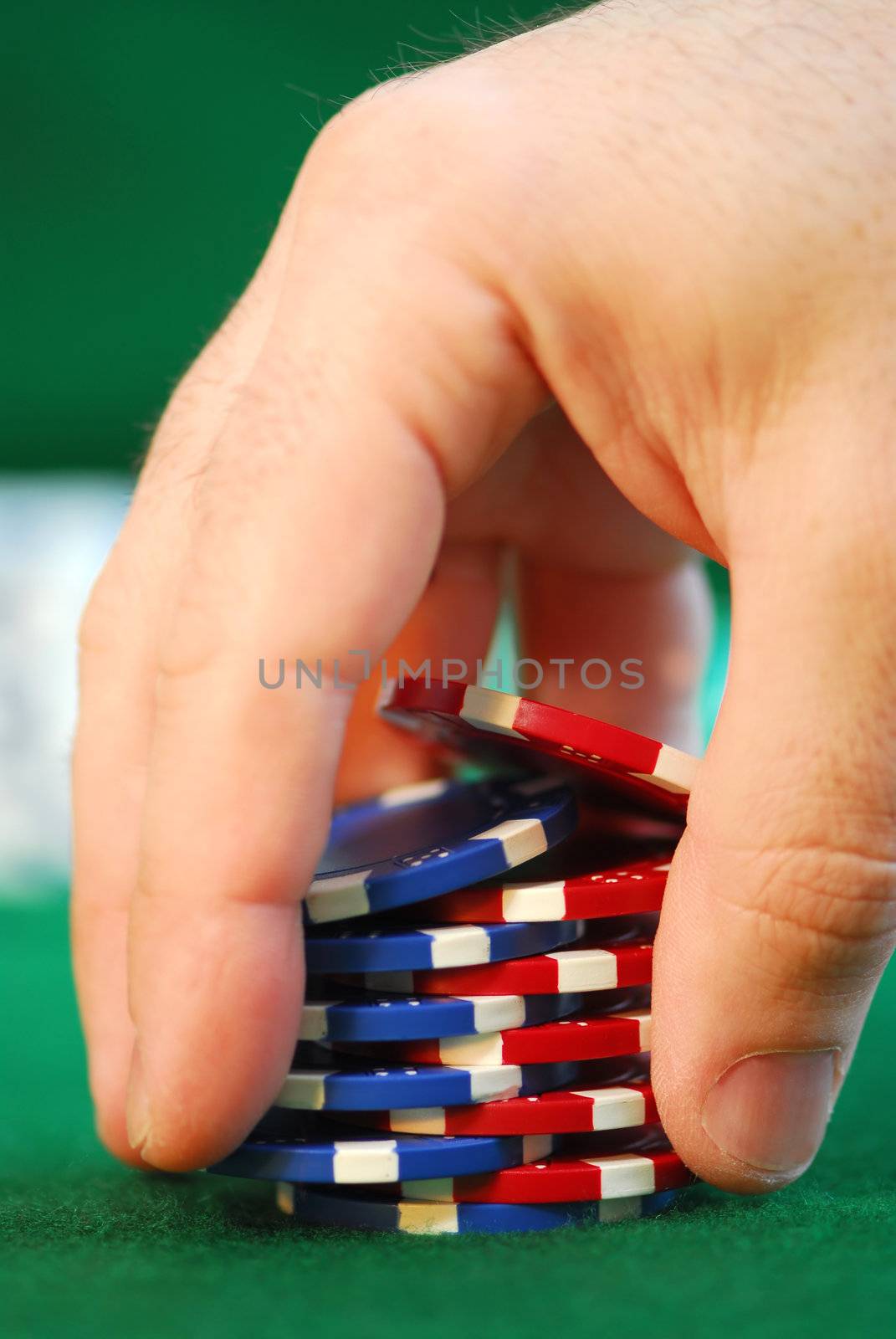 Close up on man's hand doing a pocker chip trick "shuffle"