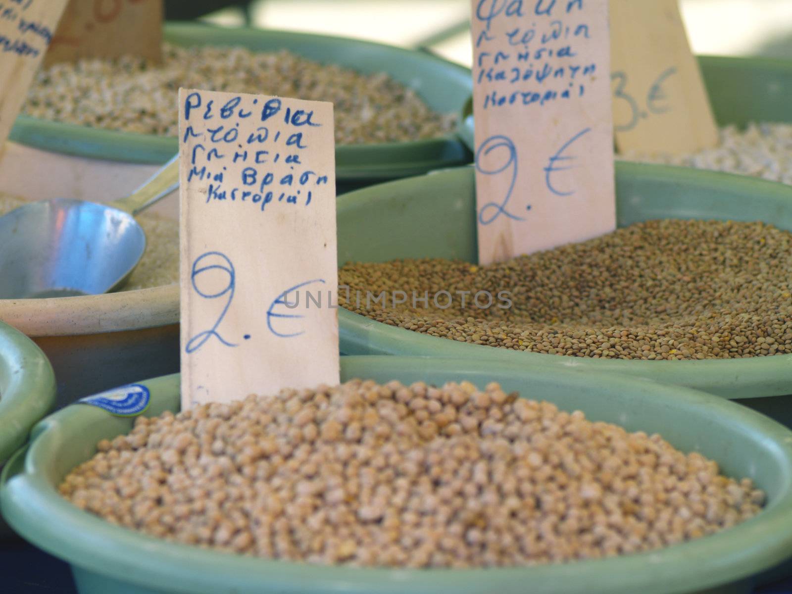 bowls of legumes on greek market stall