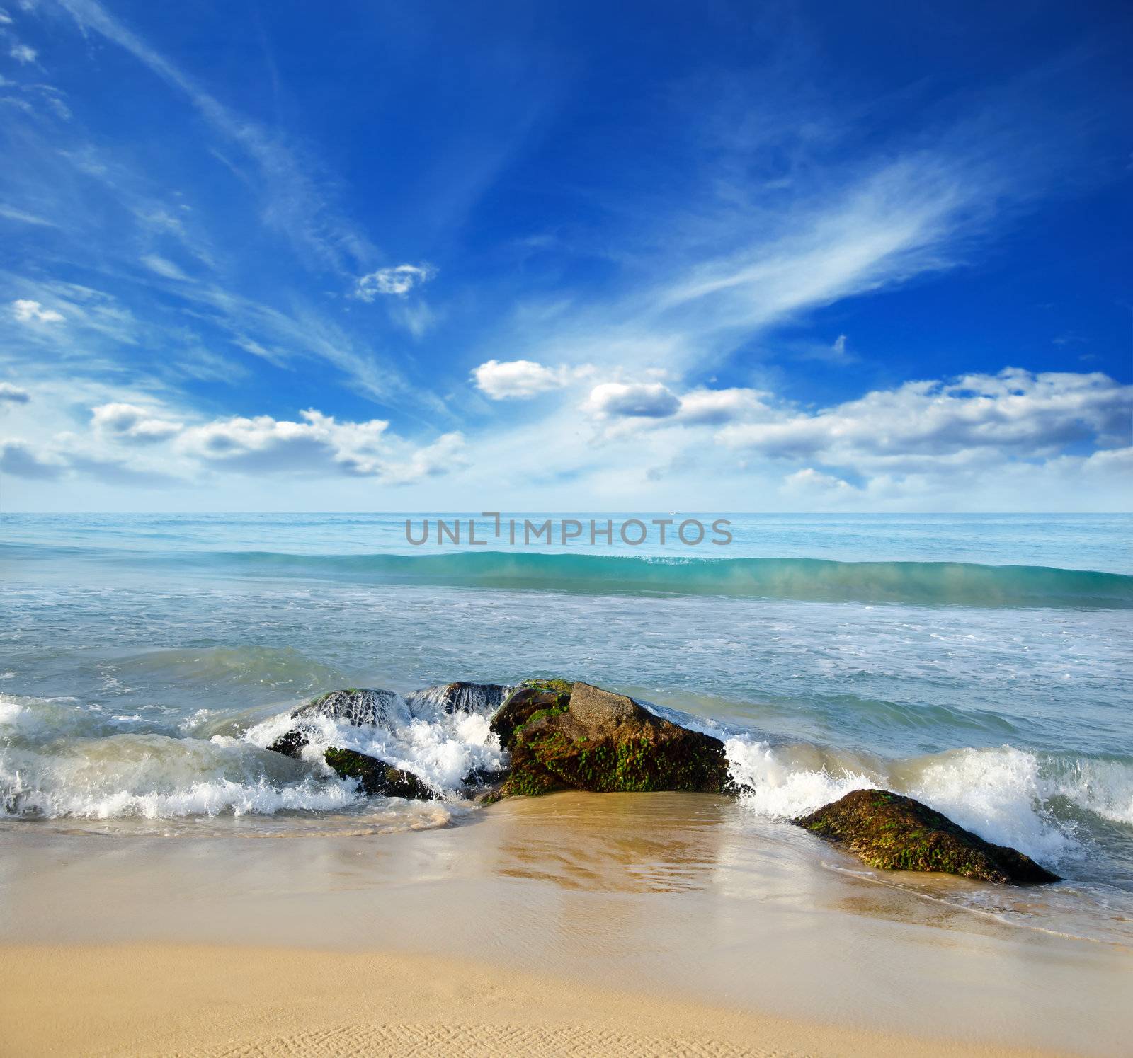 beautiful stones in the waves on ocean coast