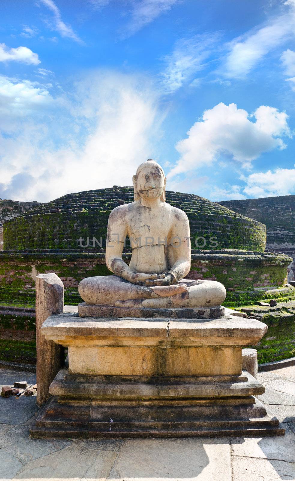 Stone Buddha image on ruins at Polonnaruwa, Sri Lanka