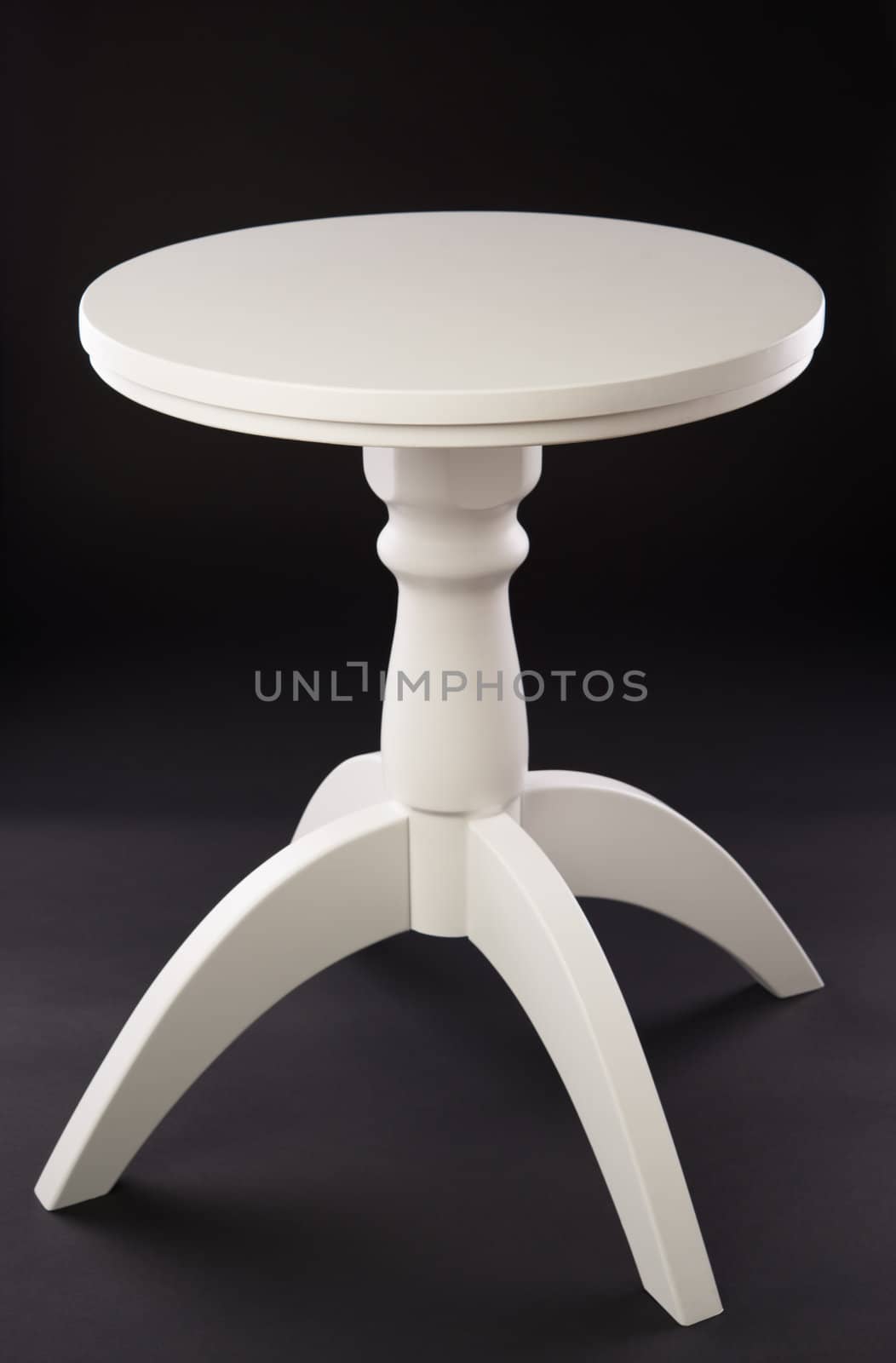 White Wooden table on black background