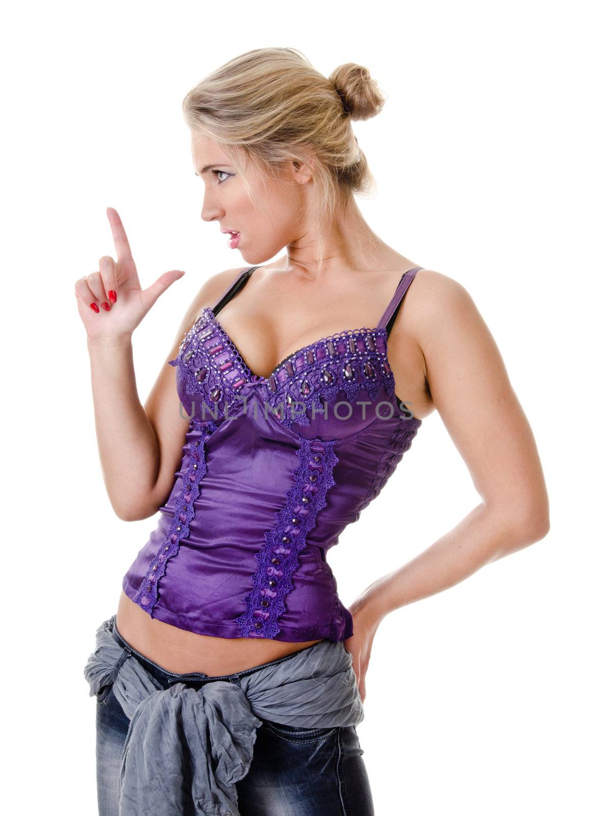 provocative portrait of a young woman in jeans and corset