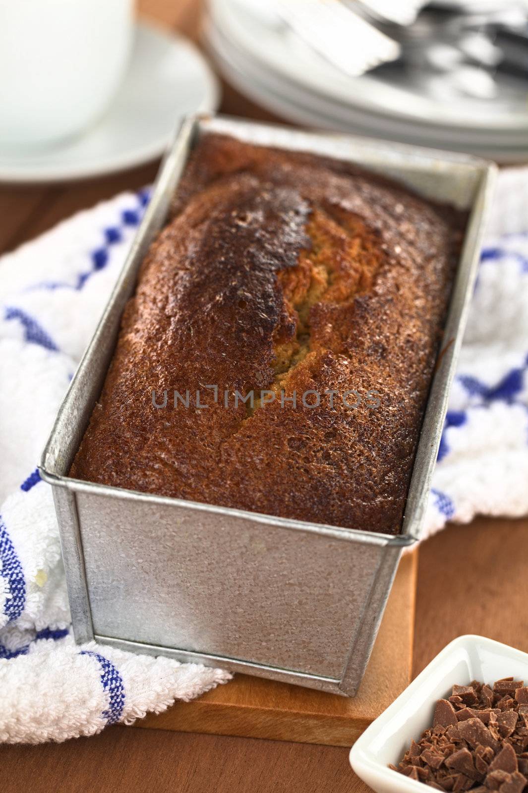 Freshly baked pound cake in baking pan (Selective Focus, Focus one third onto the surface of the cake) 