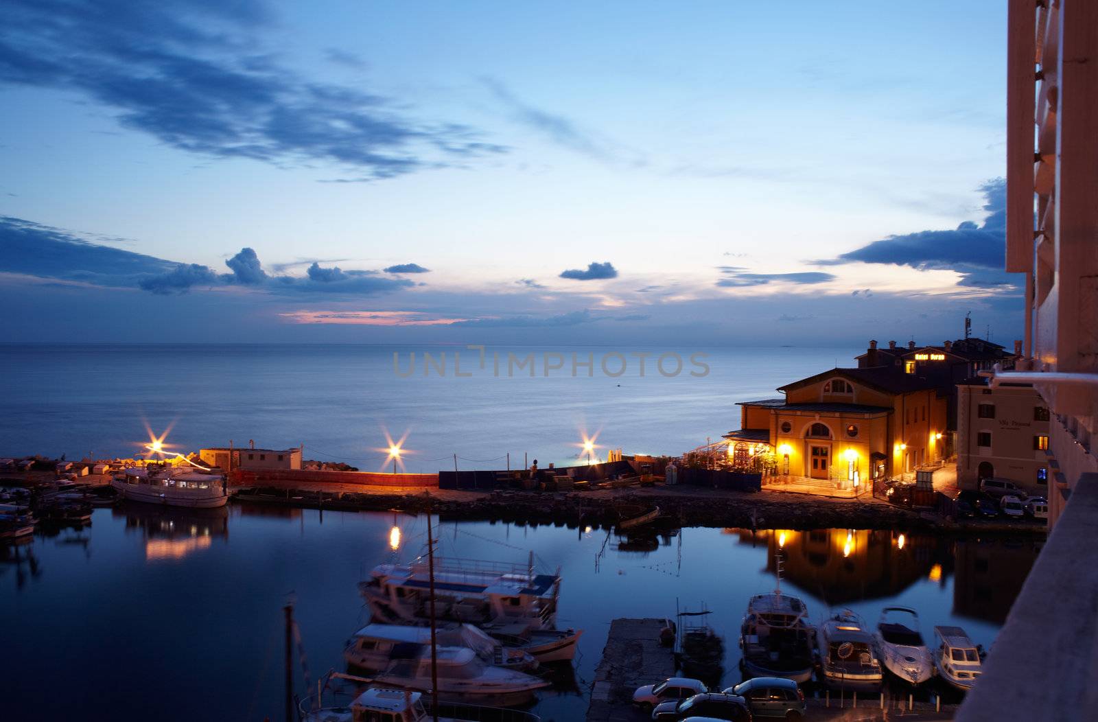 View of boats at sunset in the Piran harbor, Slovenia