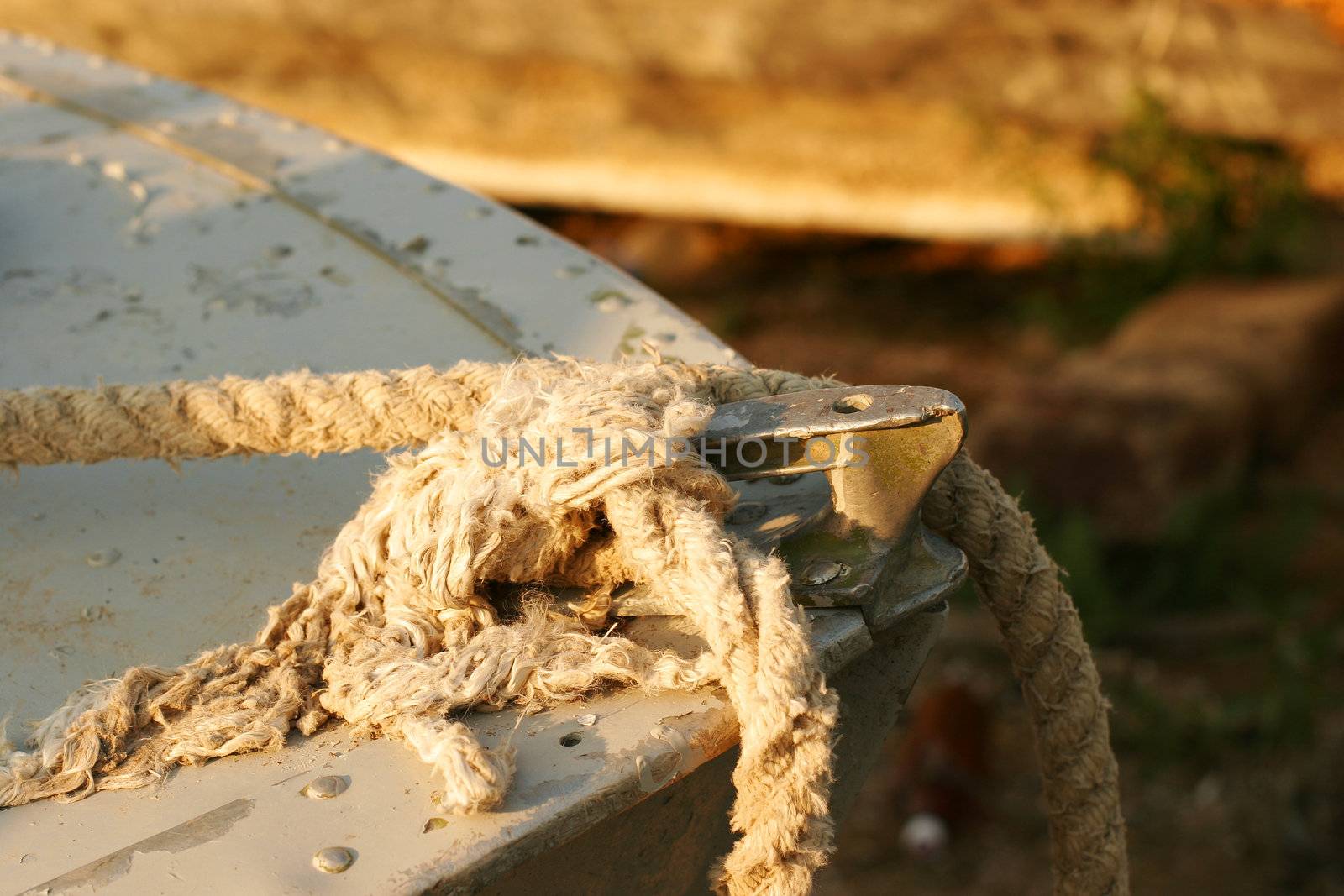 Old rope on the bow  of an old boat in the liman (lake) near Odessa, Ukraine