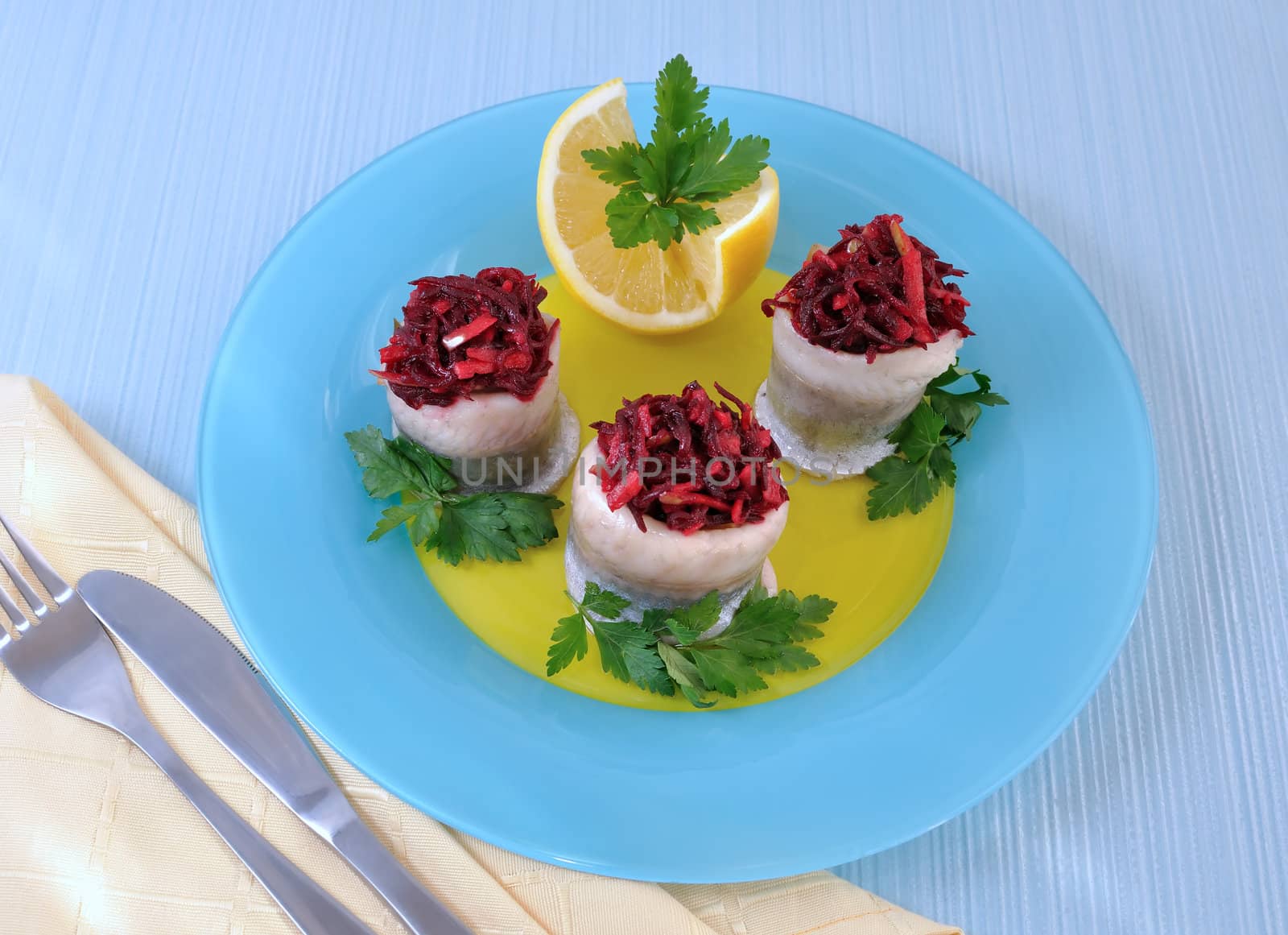 Herring fillet stuffed with beet-apple stuffing with herbs