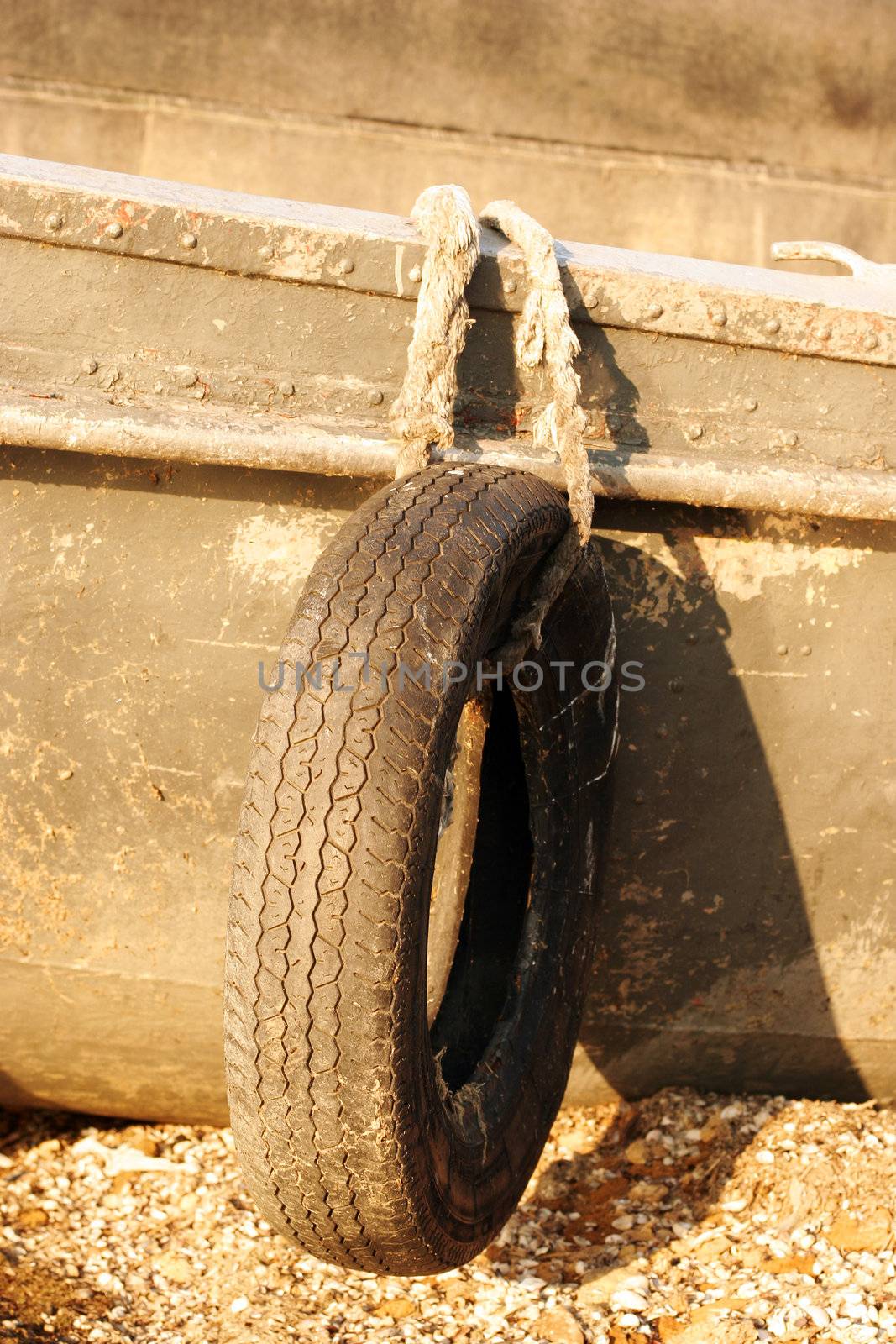 Tire bumpers on a old boat in the liman (lake) near Odessa, Ukraine