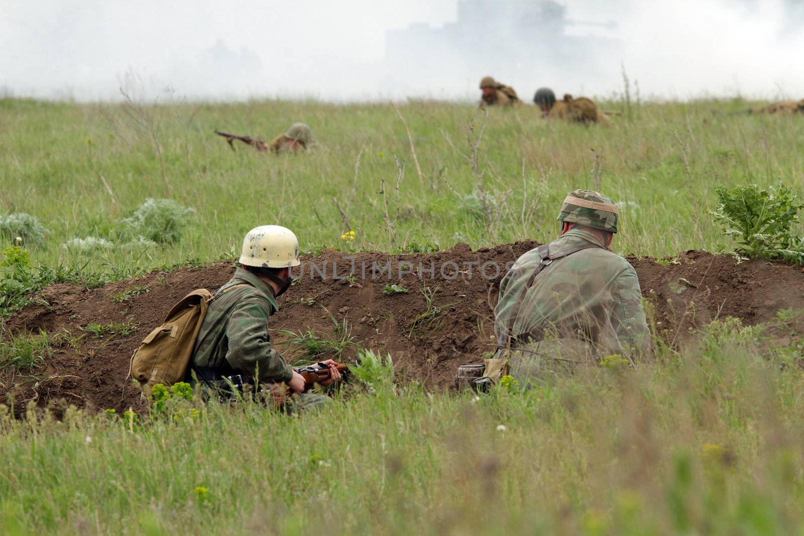 Odessa ,UKRAINE. May 8, 2011. German soldiers of WW2 at the combat. Military history club. Historical military reenacting. Demonstration for public historical reconstrucrion of one of combats between Soviet and German armies. German uniform WW2