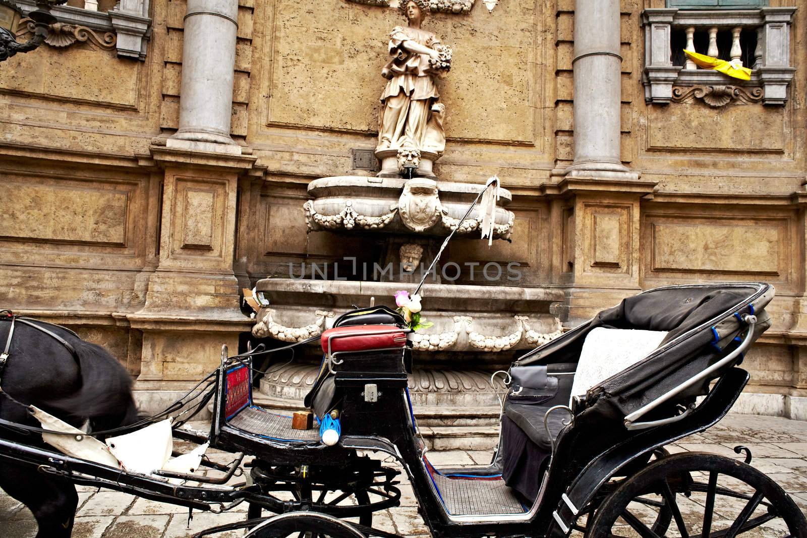 Buggy in the Quattro Canti, one of the octagonal four sides of Baroque square in Palermo - Italy