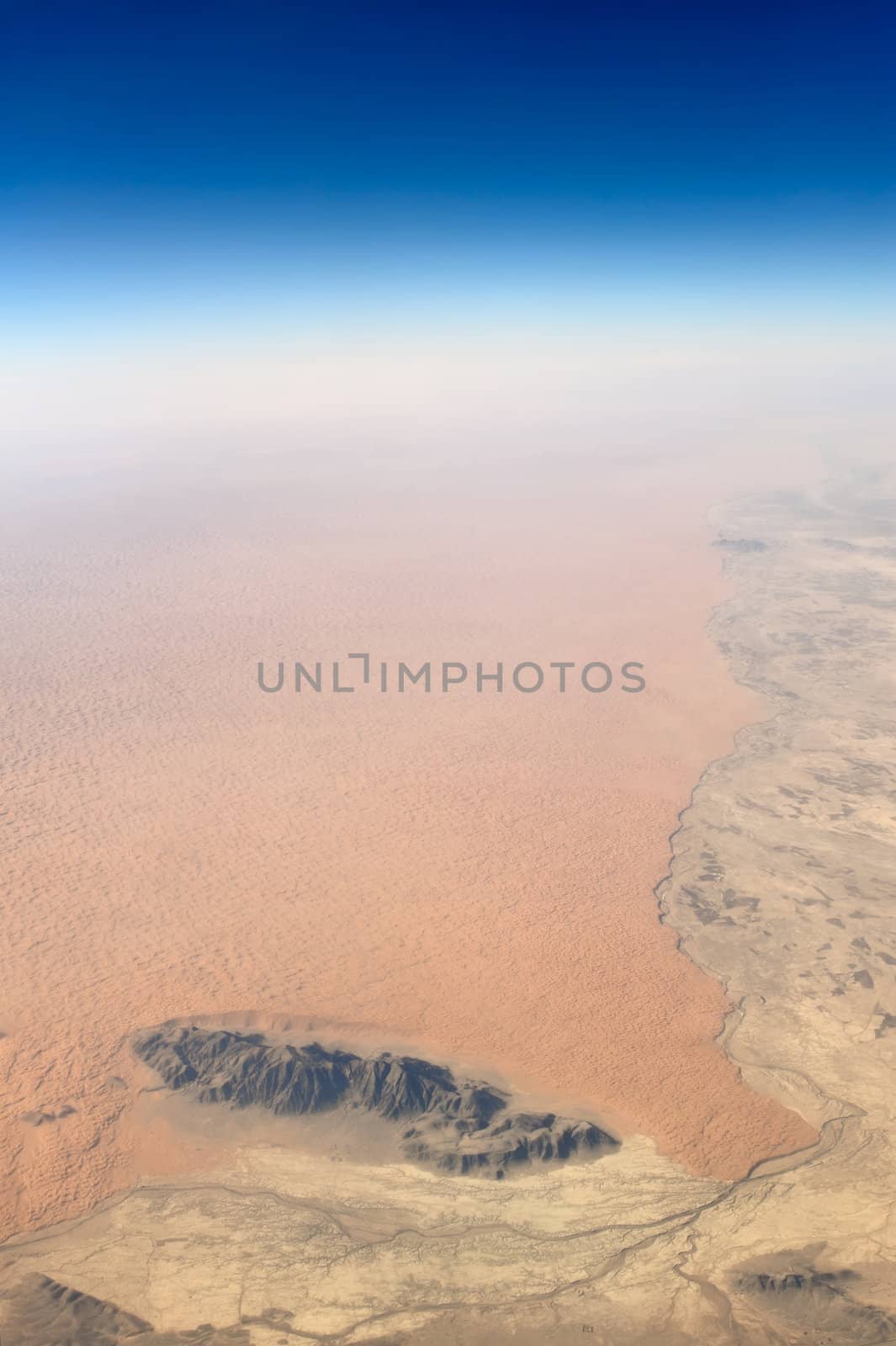 Aerial view of barren desert and rocks